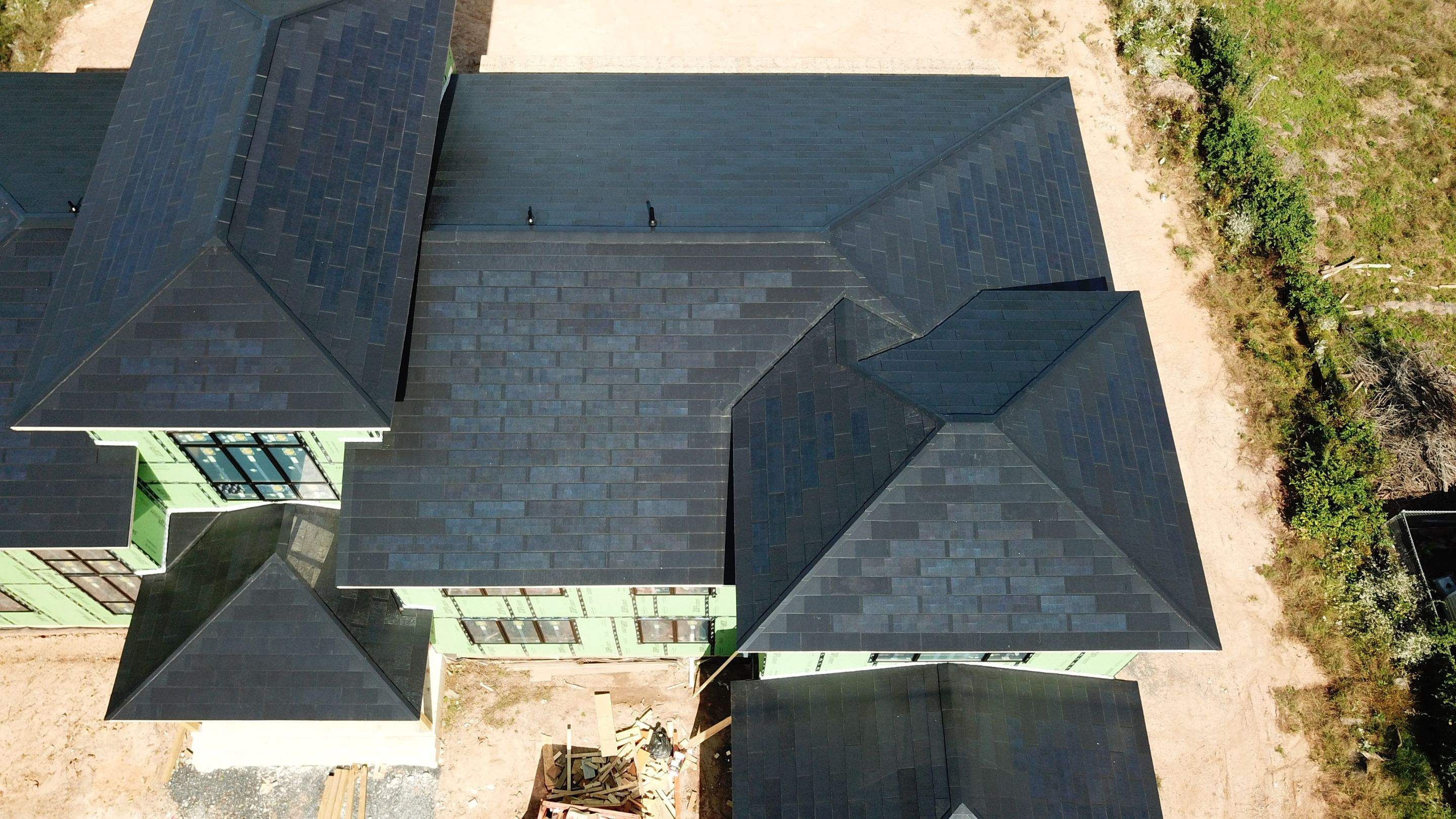 Tesla Solar Roof  using Tesla Solar Roof V3 tiles by American Home Contractors
