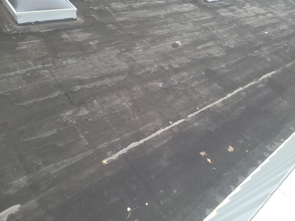 Commercial Roofing Repair using UniFlex Silicone Roof Coating by 3 Daughters Construction 