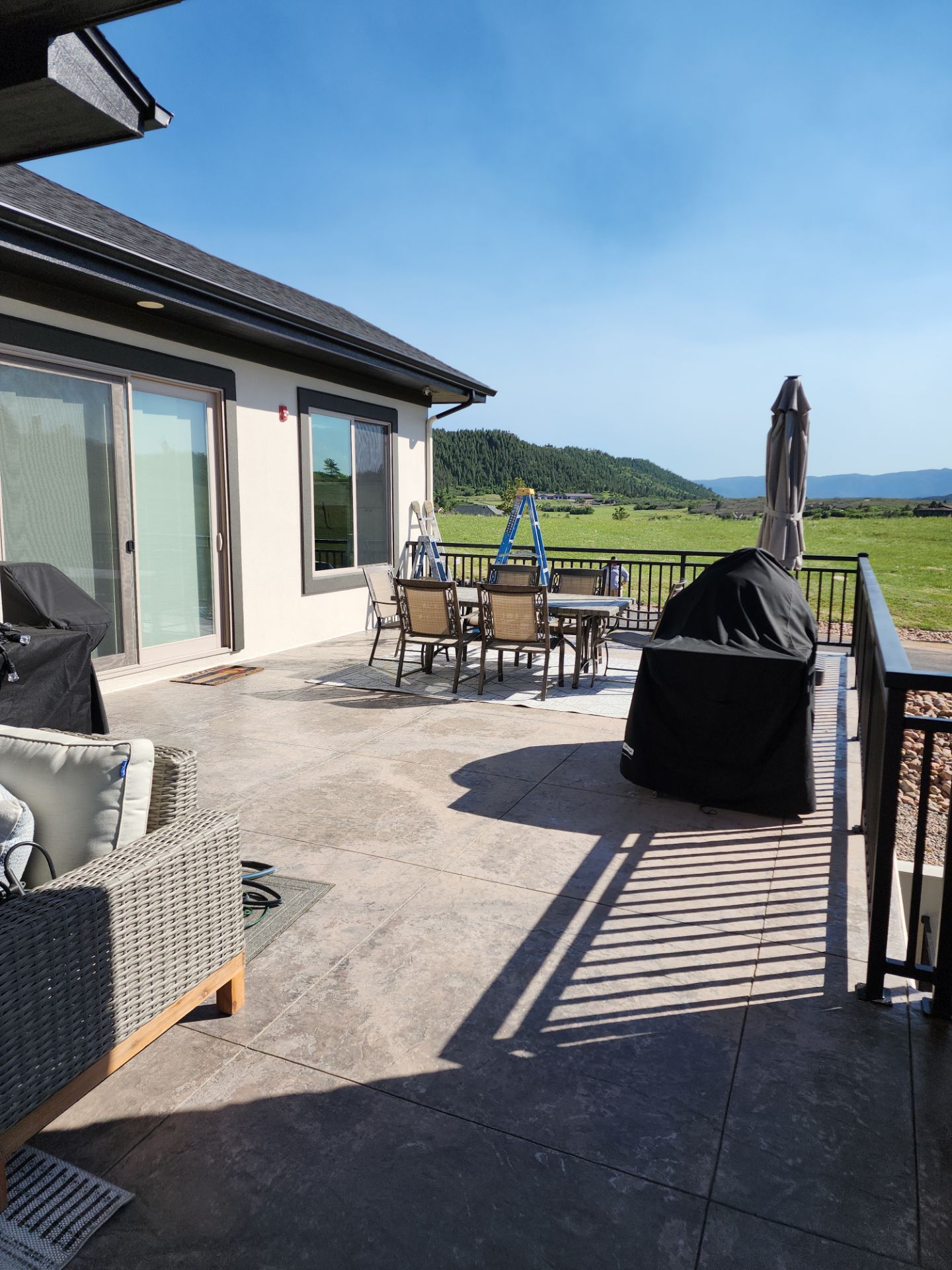 Castle Rock Elegance: White Stucco Exterior with Bold Tricorn Black by J&M Painting LLC