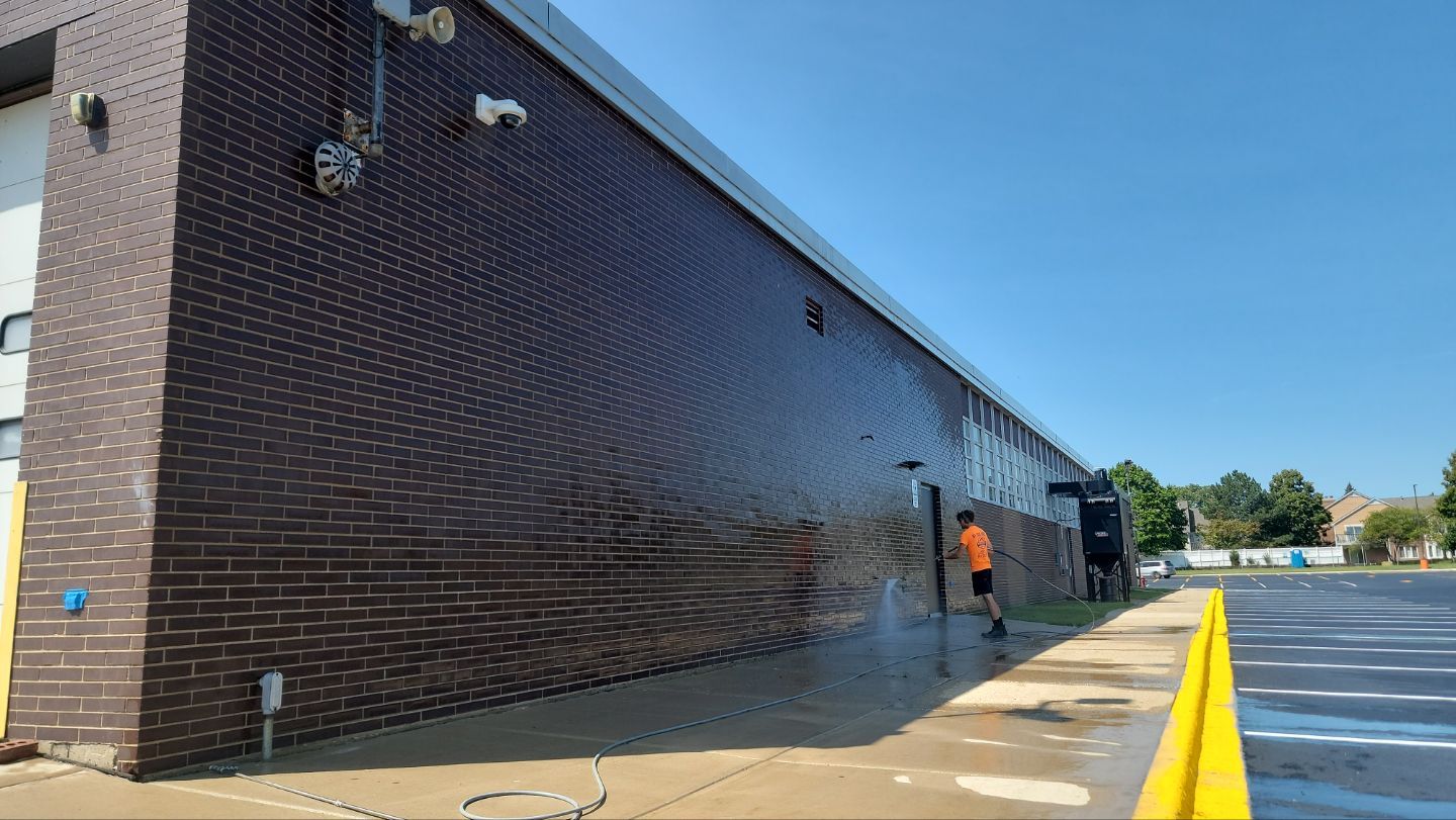 commercial pressure washing using Algaecide, soft wash soap by Northern Power Washing LLC.