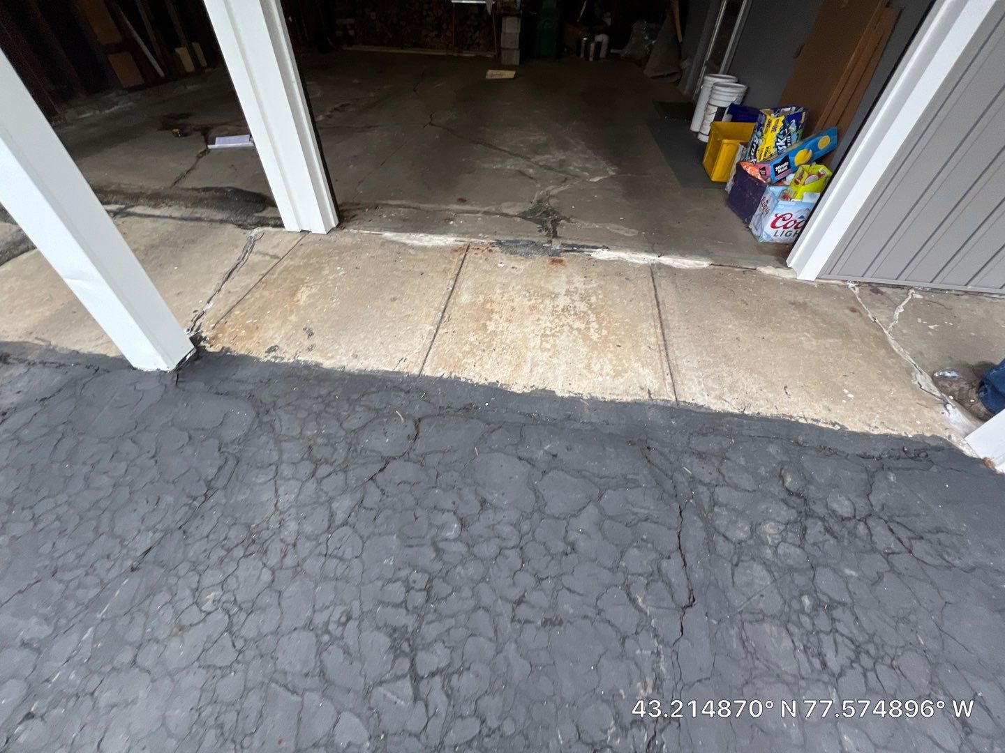 Concrete garage floor replacement with a broom finished apron and sidewalk  by NG Masonry & Construction LLC
