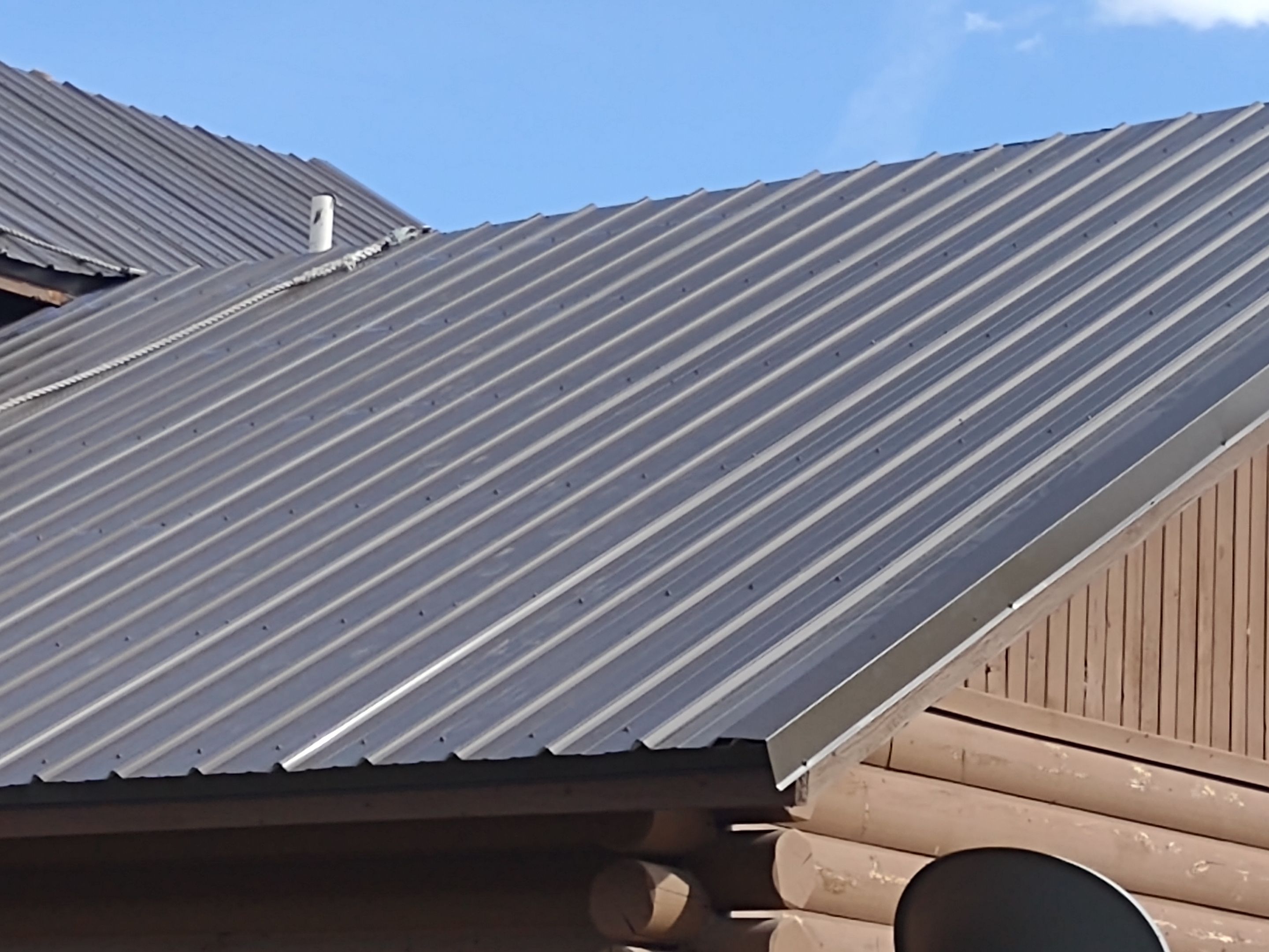 Hill Country Guest Ranch using Steel Roofing, Gutters, Log Cabin Staining by Lightning Exteriors