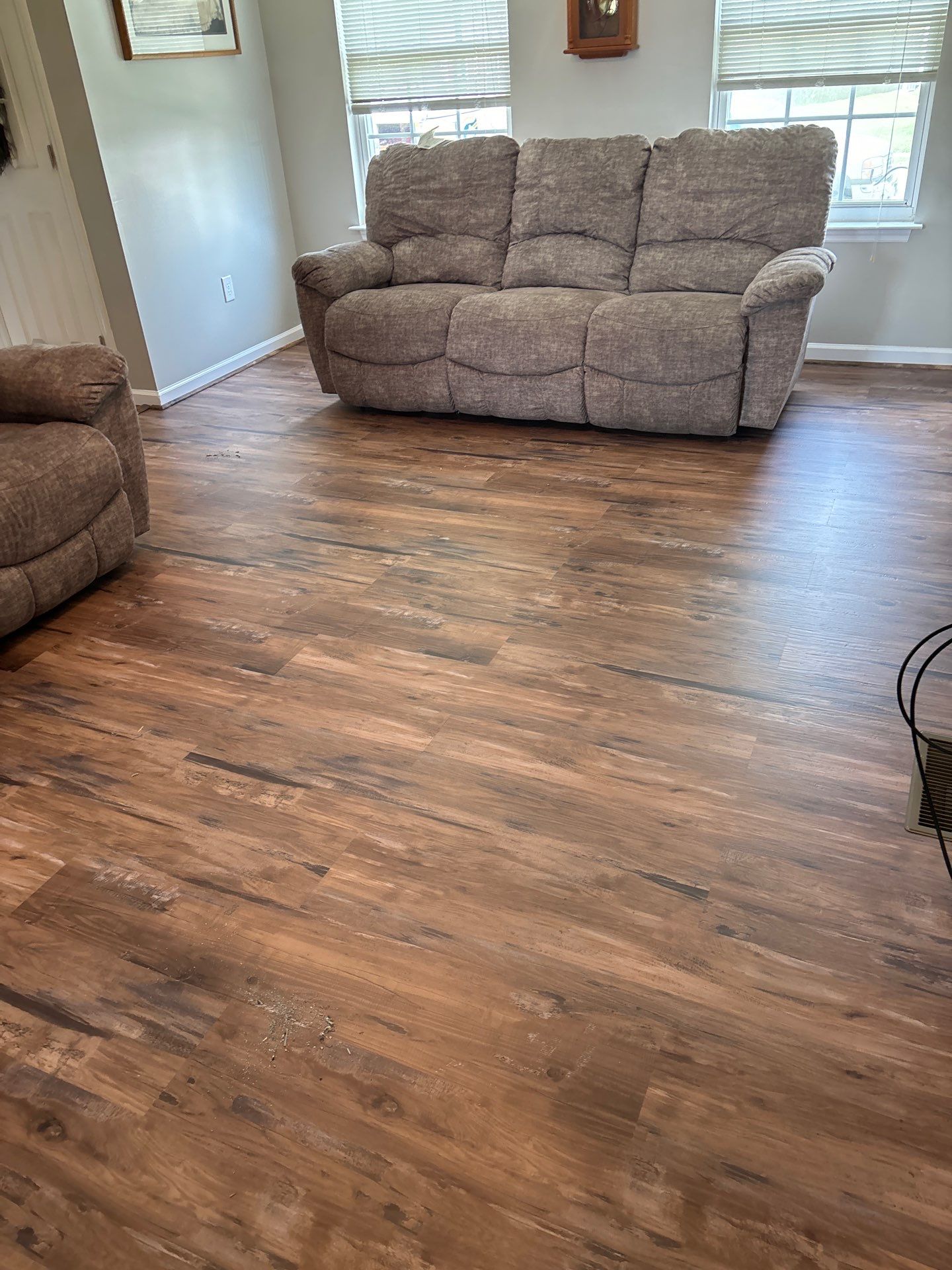 Living room LVP Flooring install  by Laser Focused Solutions LLC