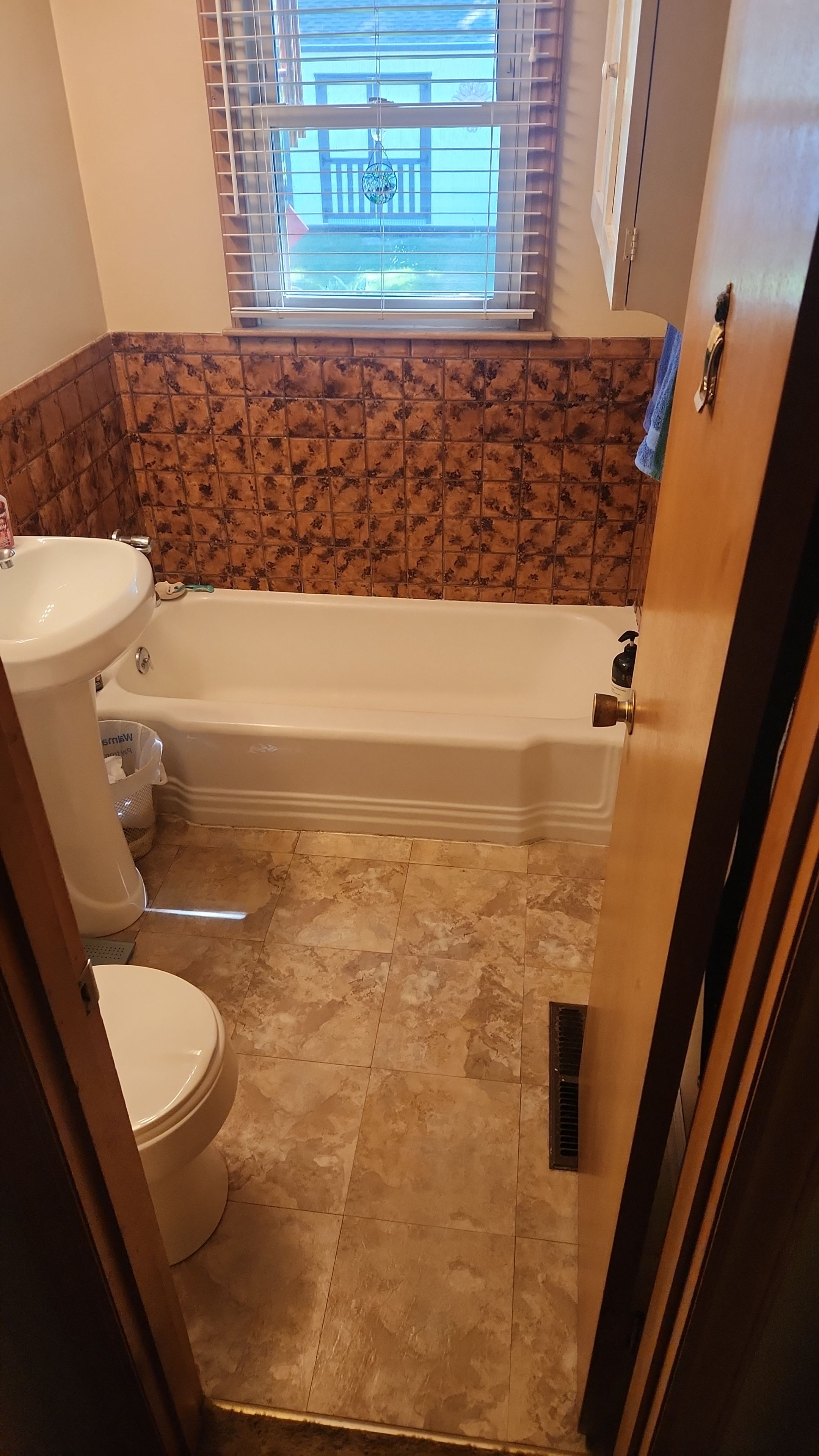Tiny Bathroom Remodel by The Shower Company