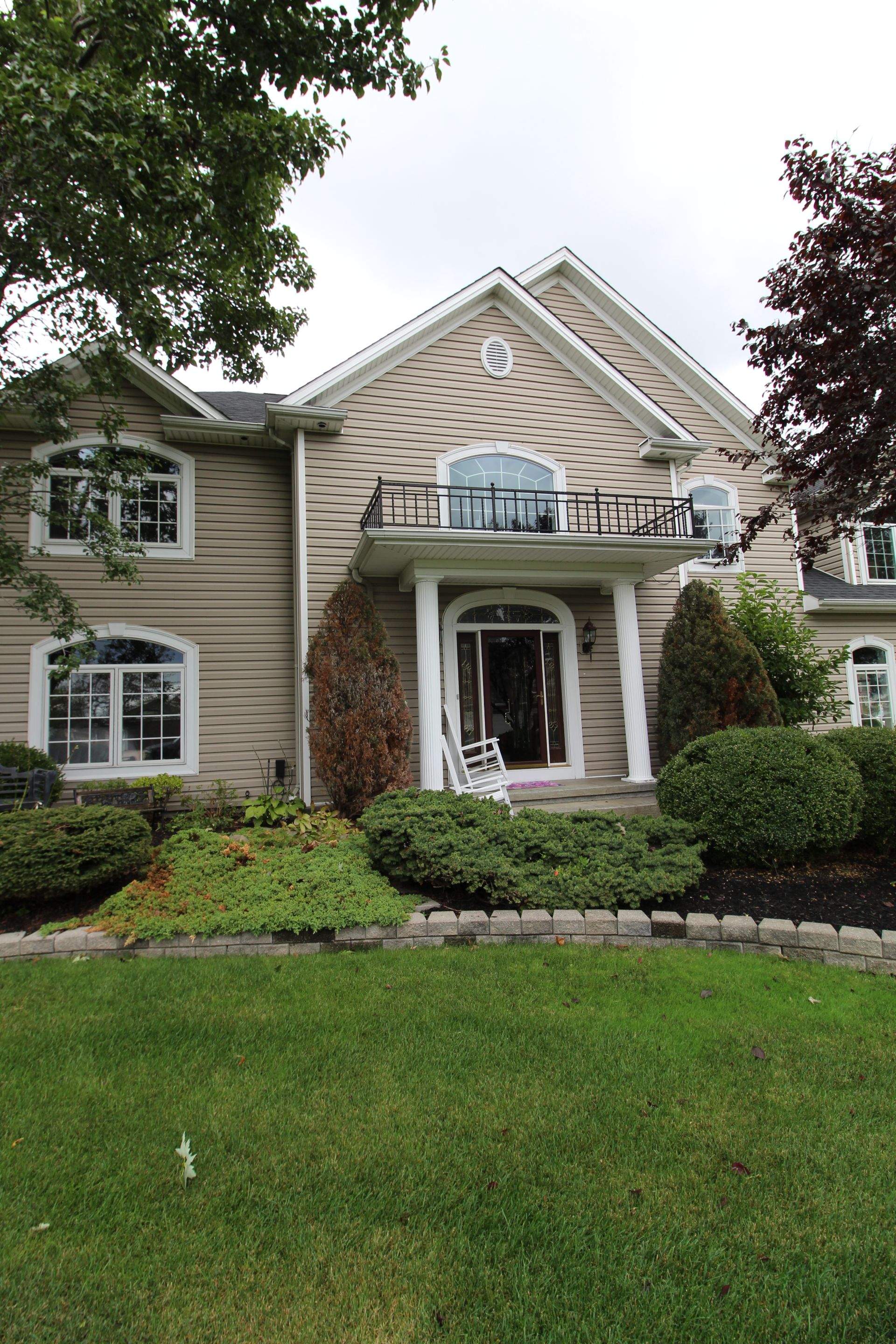 Exterior Renovations- Siding, Concrete, Railings, and Entry Door  by Ivy Lea Construction
