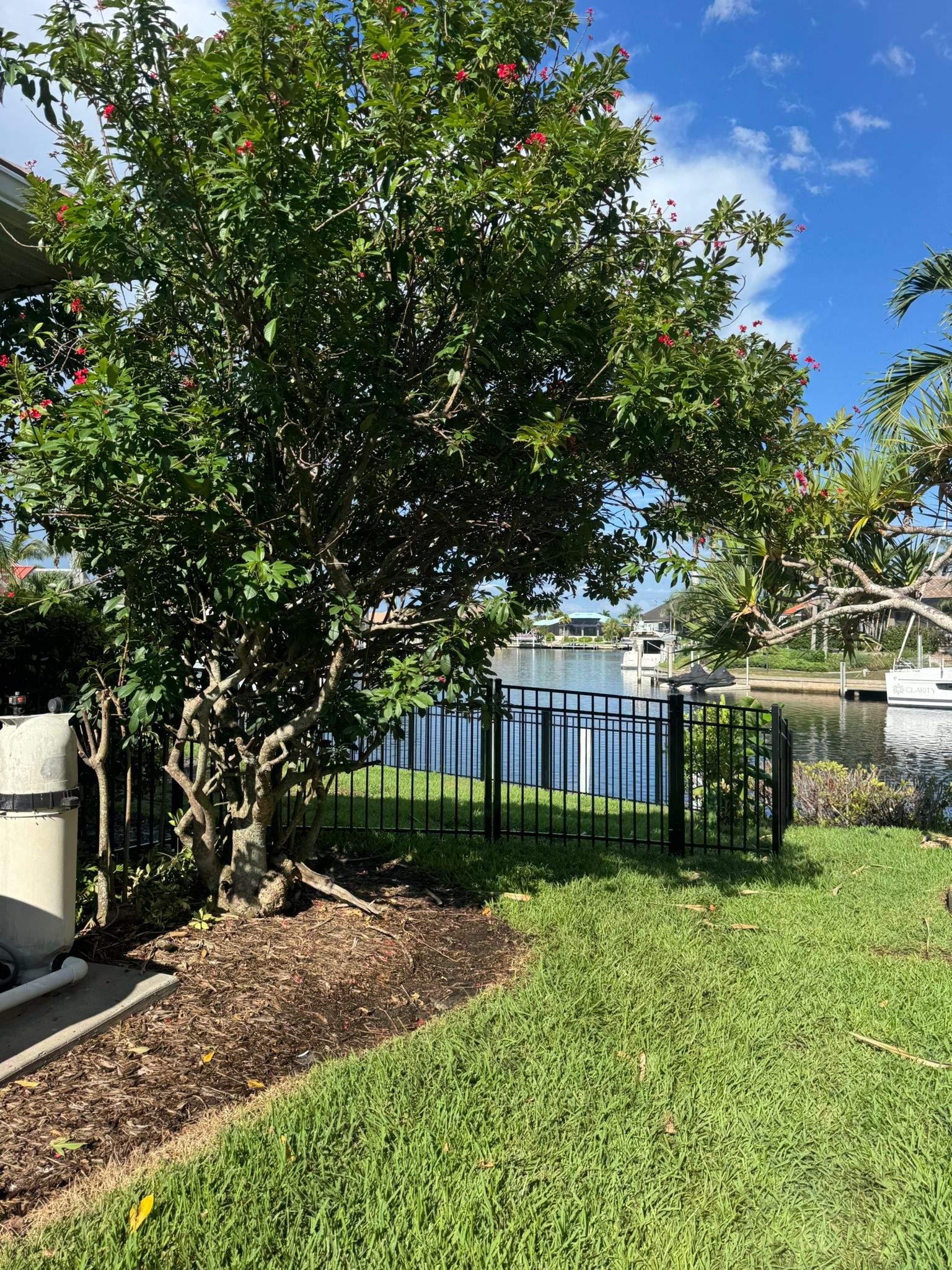 Black Aluminum Fence Installation Along Punta Gorda Canal by True Fence LLC