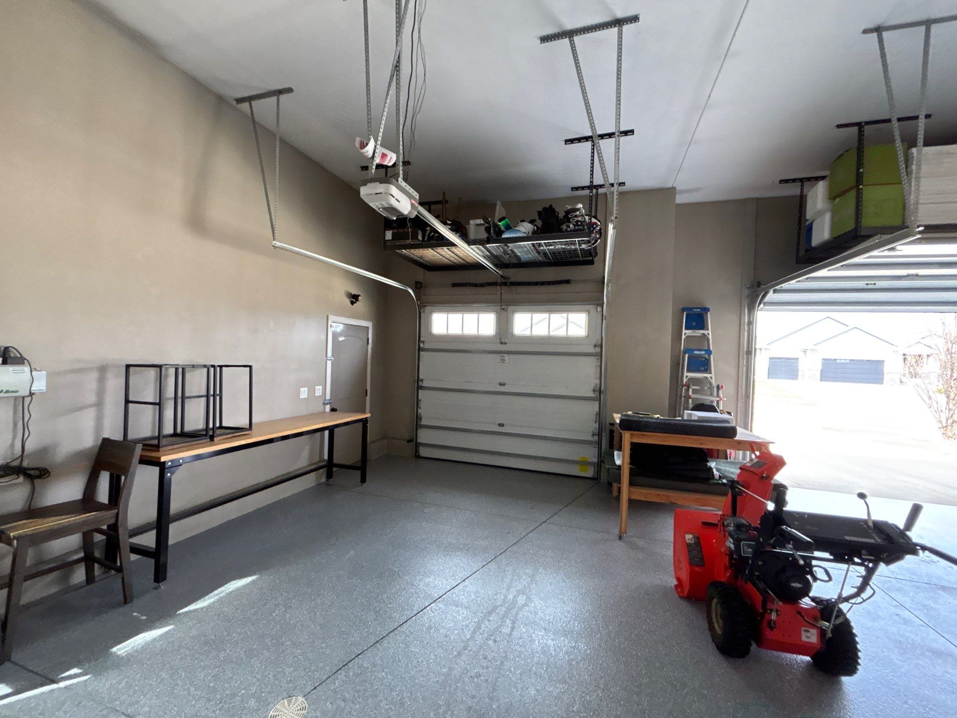 Speckled Grey Epoxy Garage Floor Coating Installation in Tea by Select Painting, Coatings & Garage Cabinets