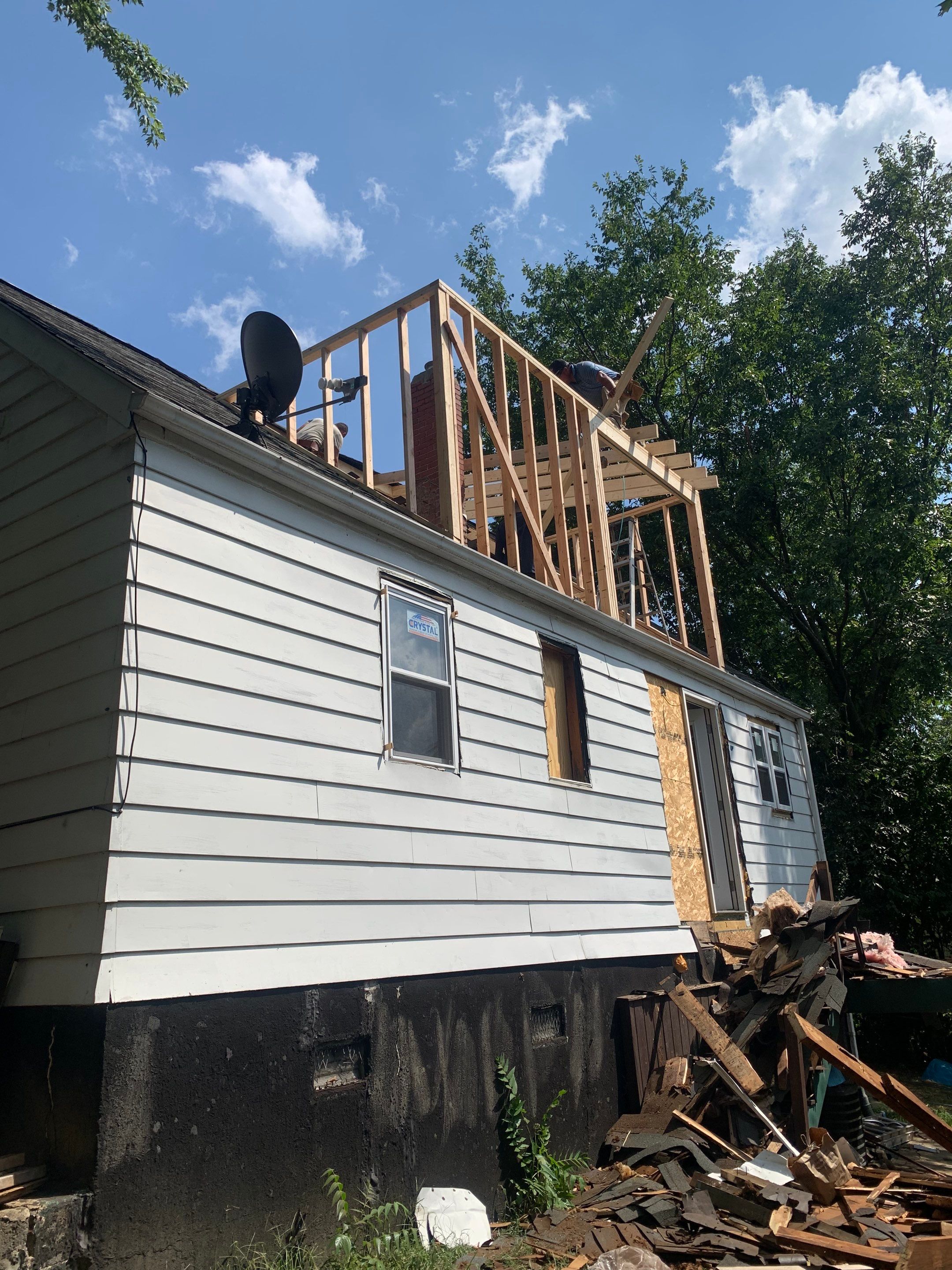 Room addition on the second floor of house by Greenspring Construction Services
