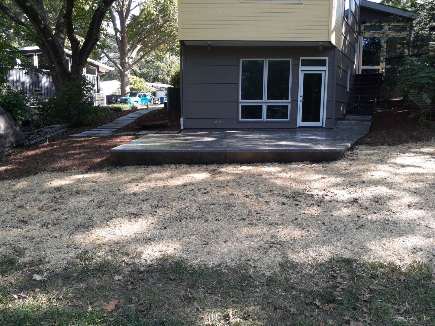 Back Yard Cantilivered Patio by LAND ESCAPES LLC