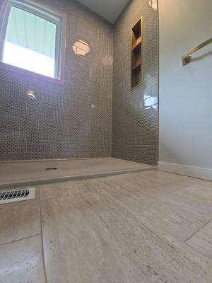 Full bathroom with custom tile