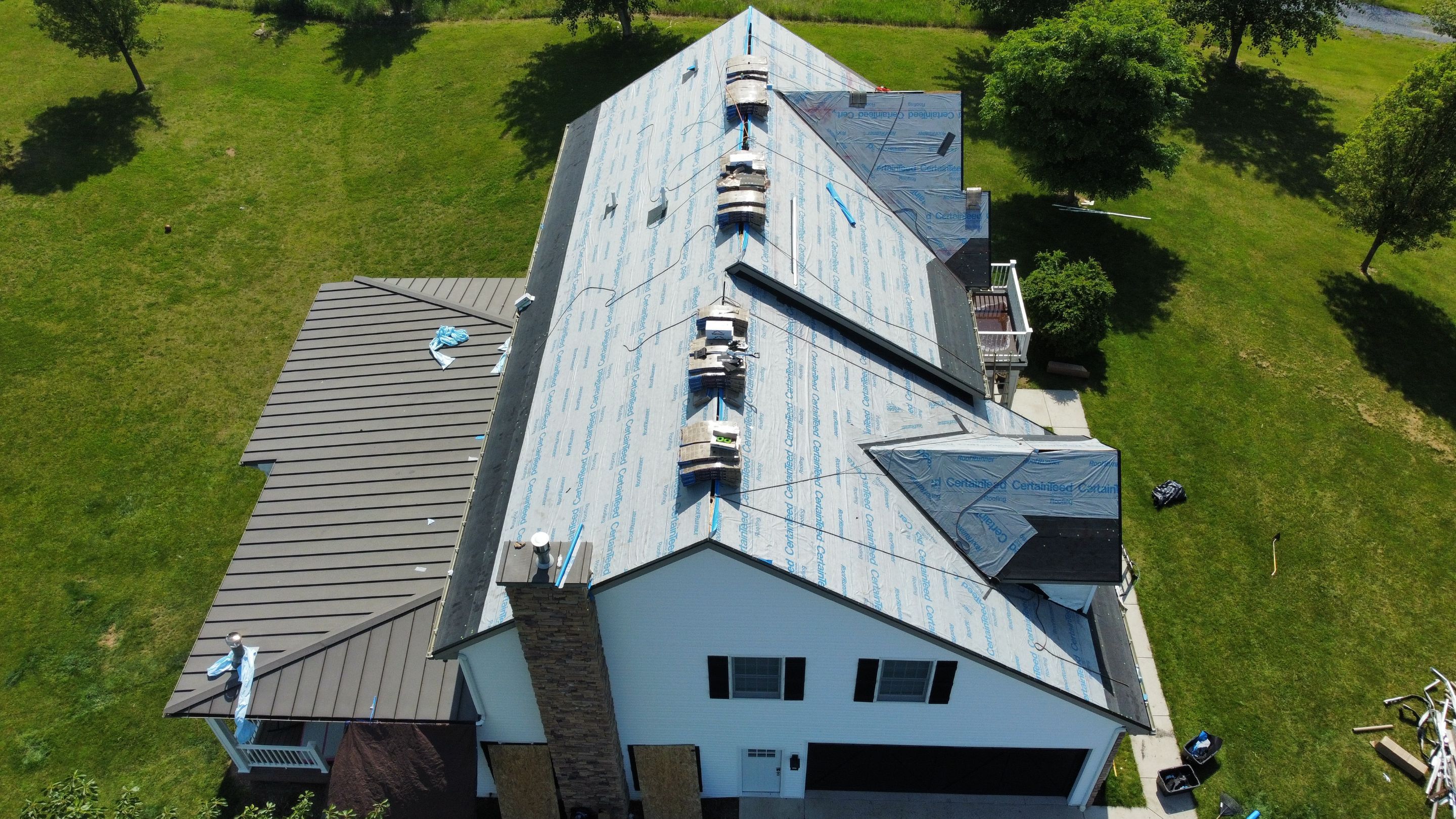 Roof Damage using Certainteed Lifetime Roofing System- Moire Black Landmark Pro shingkes with shadow ridge caps. by BulletpROOF Exteriors