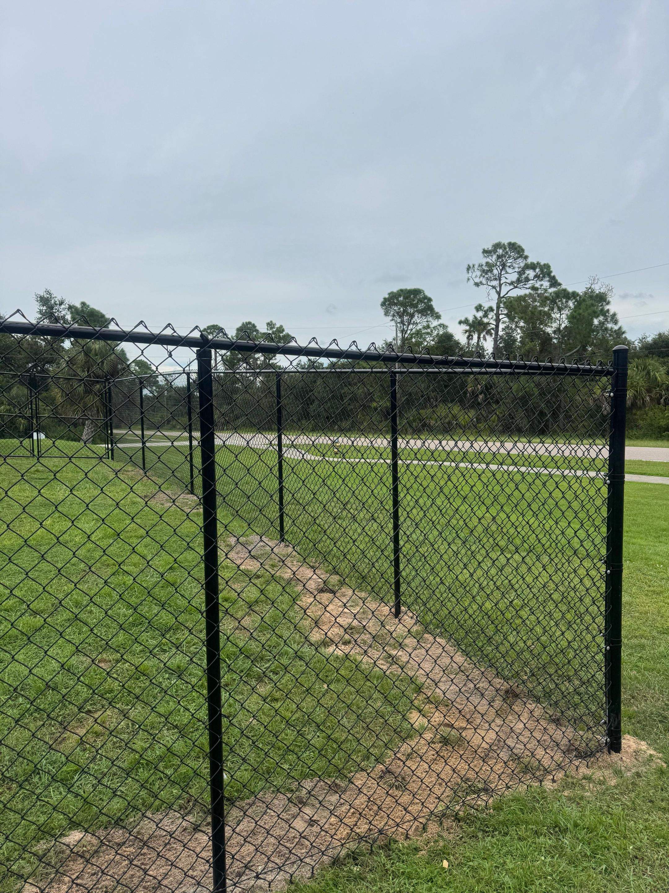 Black Chain Link Boundary Fence with Access Gates in North Port by True Fence LLC