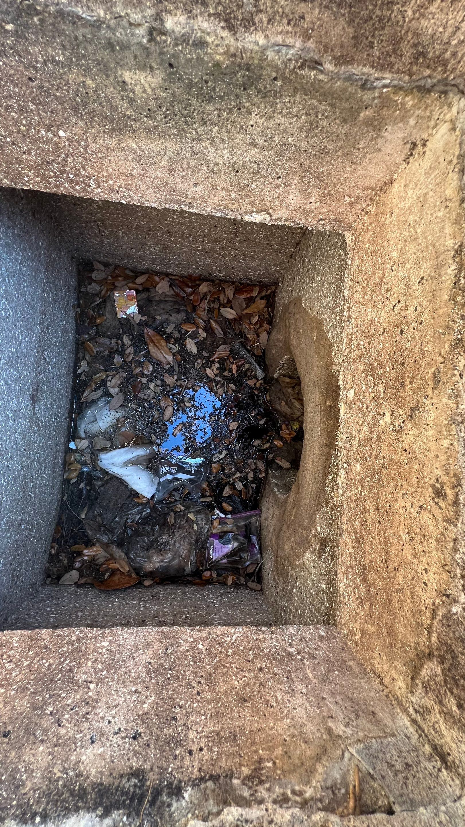 Cleaning Debris Filled Catch Basins by APS Power & Water
