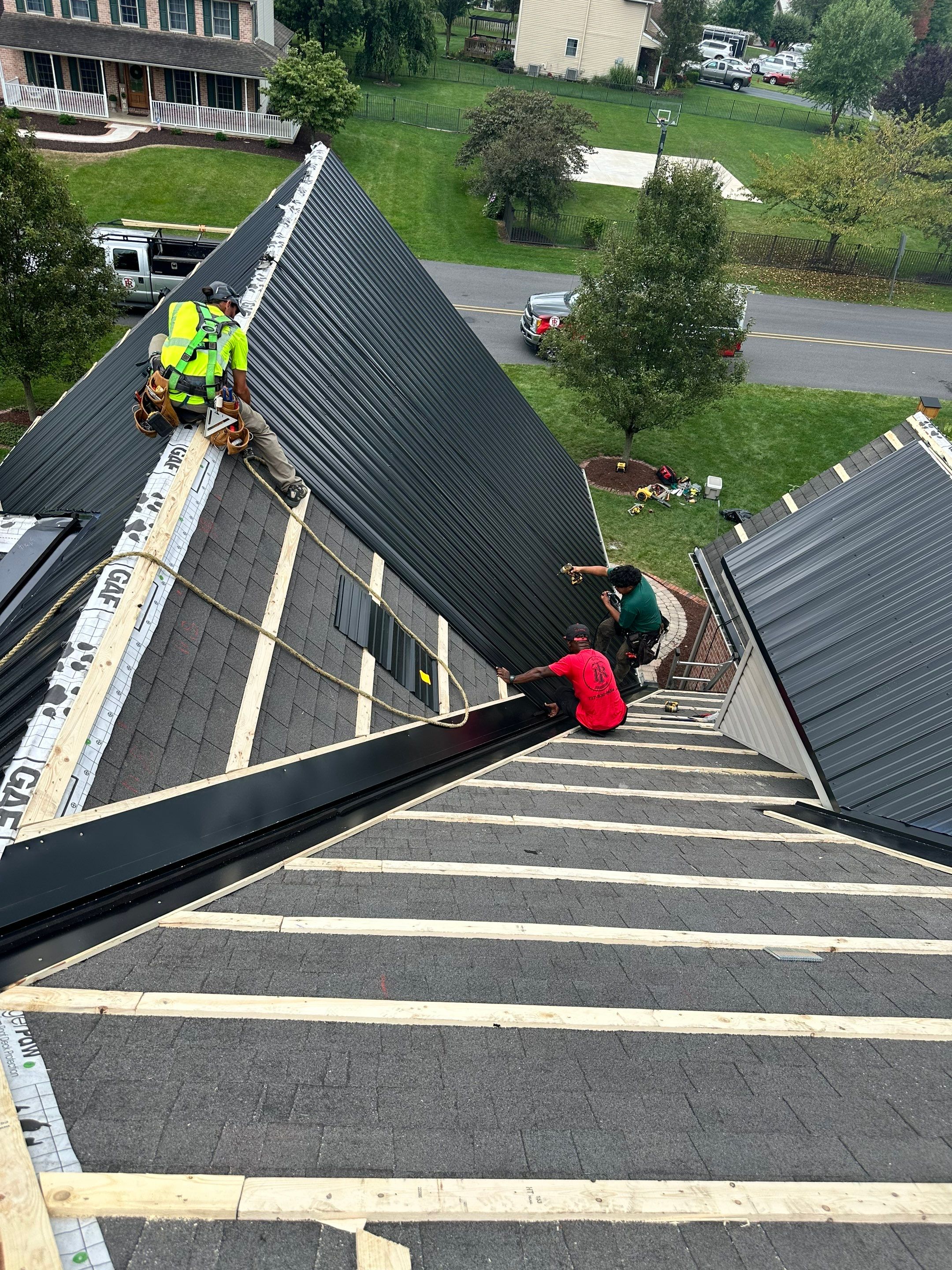 Standing seam / Azm panel in black  by Teflon Roofing