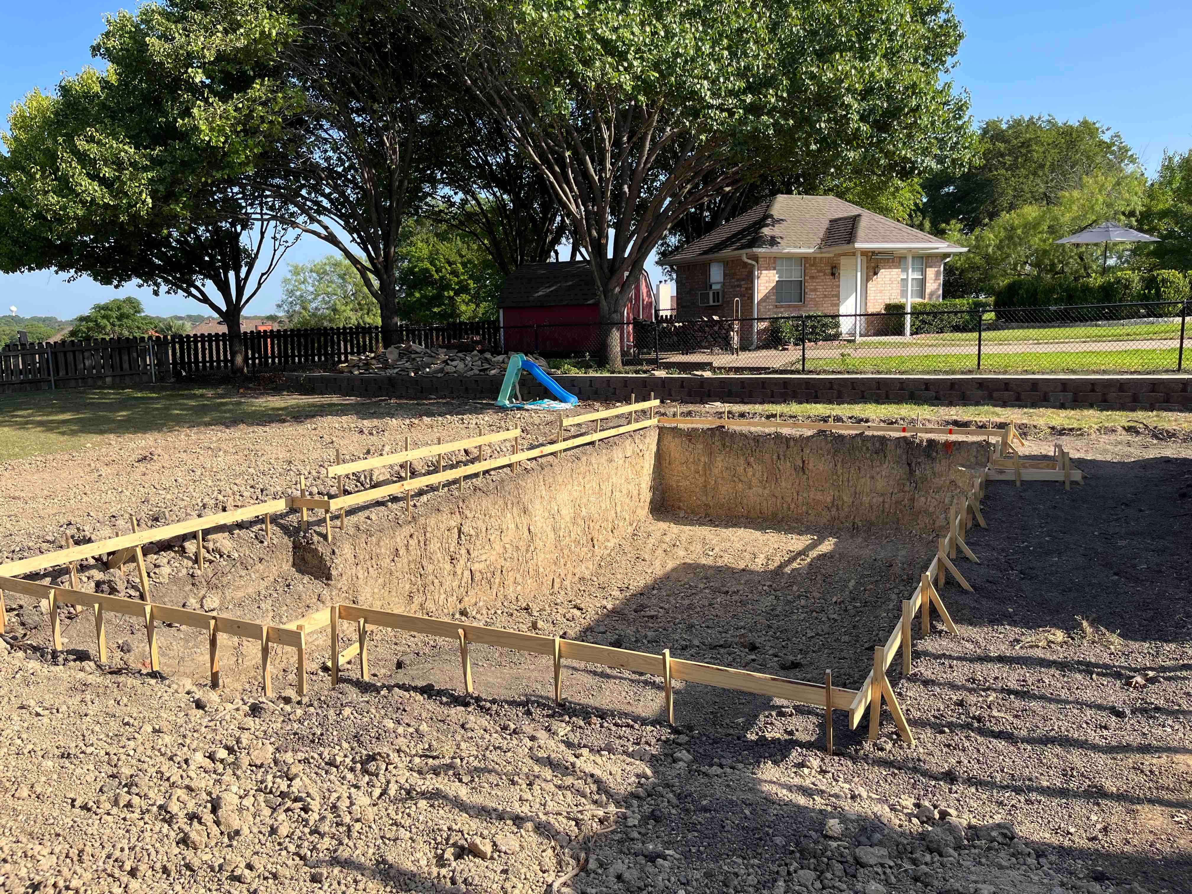 Geometric Pool with Raised Spa and Slide by Pinnacle Pools and Spas - DFW