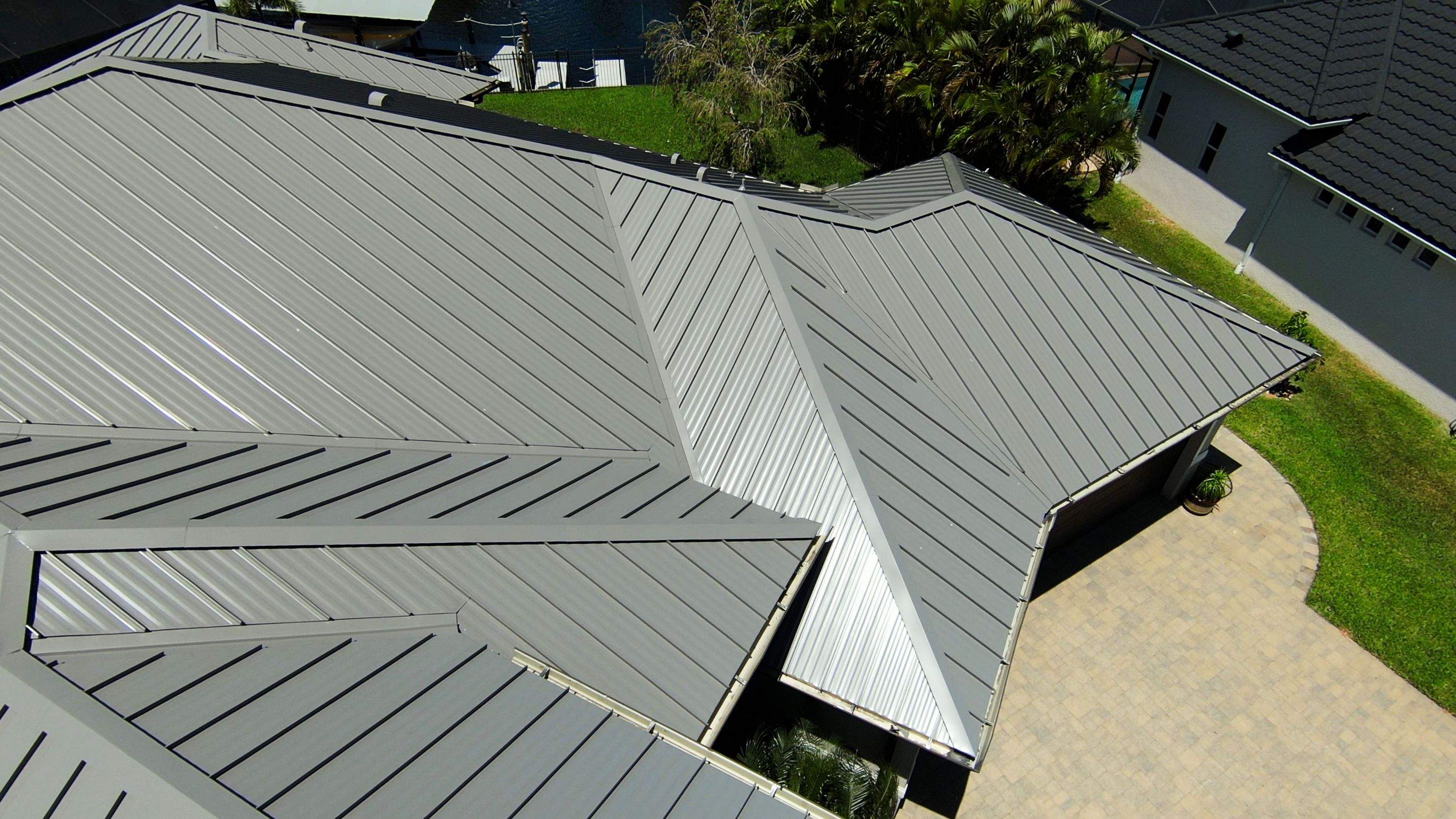 Residential Roofing Installation using Gulf Coast Metals Gulf Seam Panels by Four Peaks Roofing
