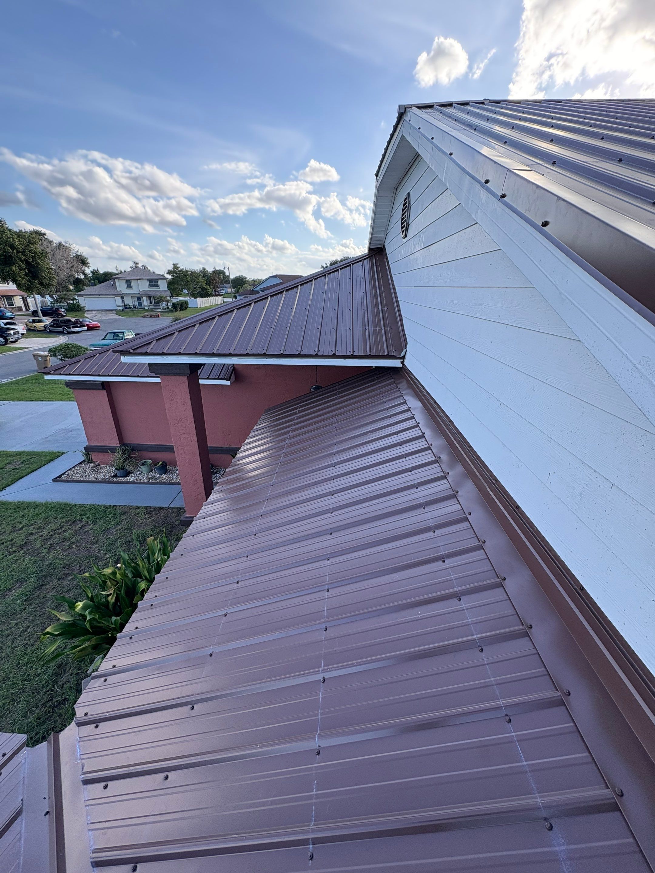 Residential Metal Roofing Installation and Gutter Replacement in Kissimmee by Pinnacle Roofing Group