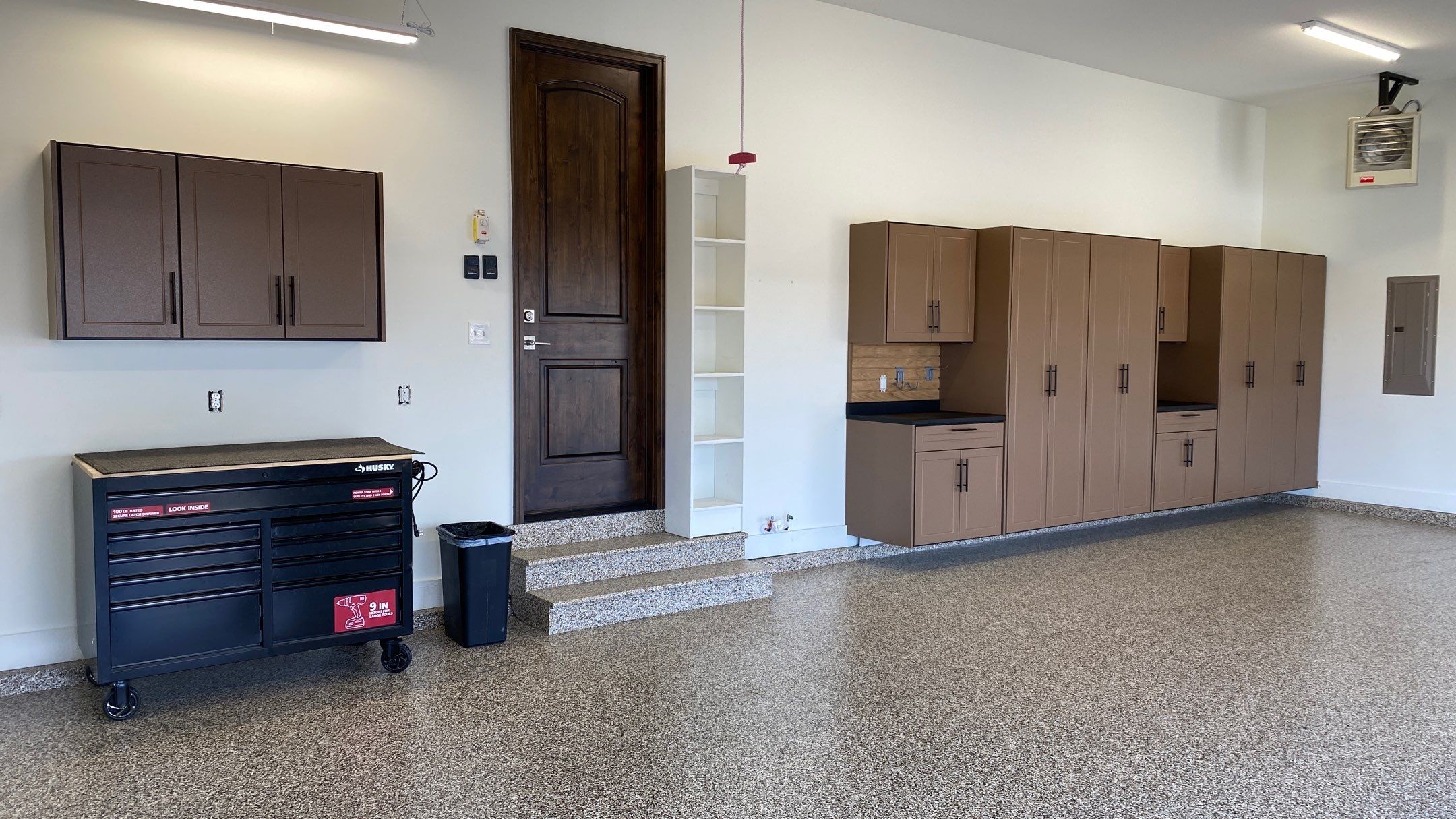 Kenny & Debbie transformed their garage with a Banner Garage Floor and cabinets by Banner Garage