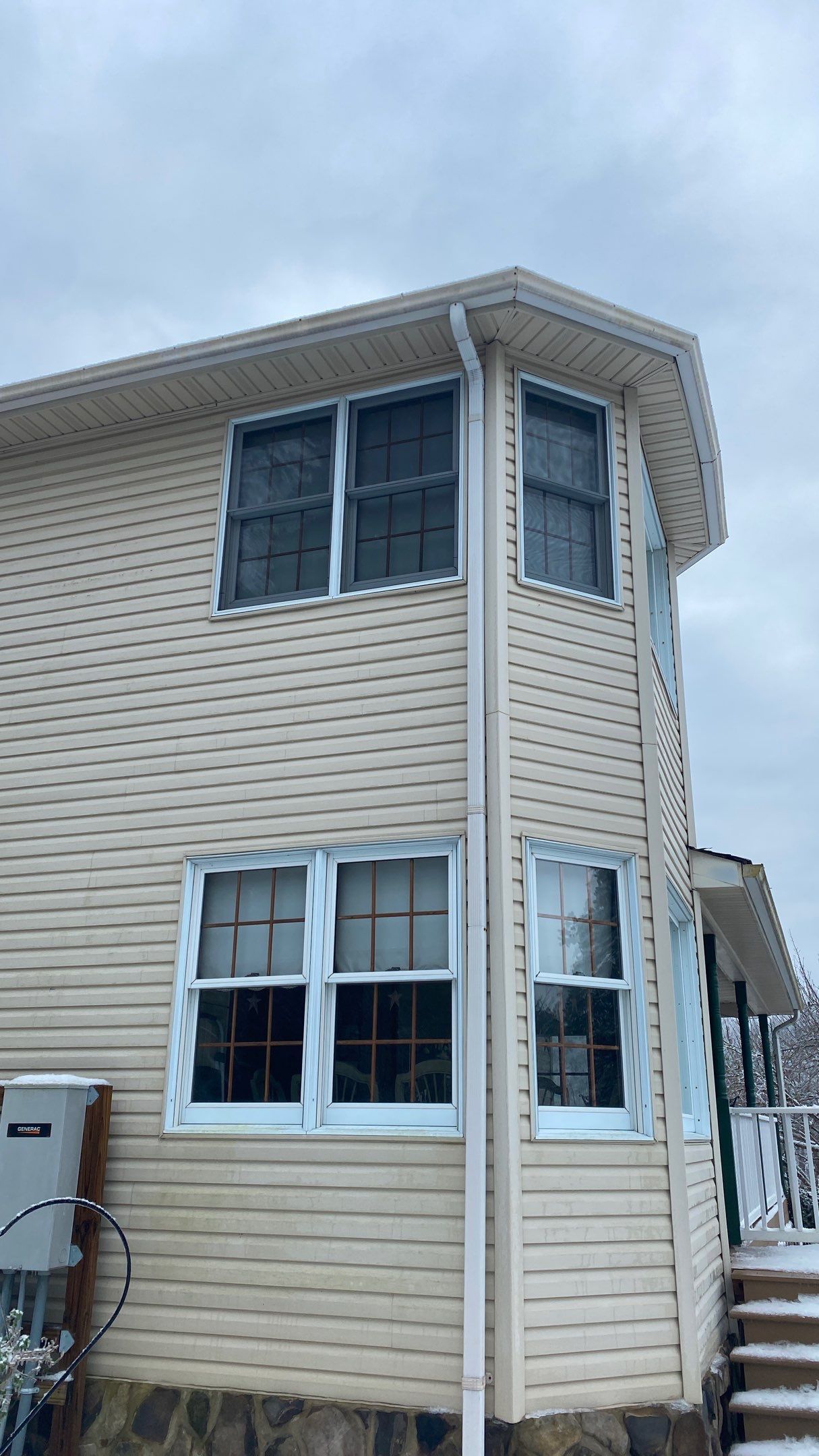 Exterior remodel including window replacement by American Home Contractors