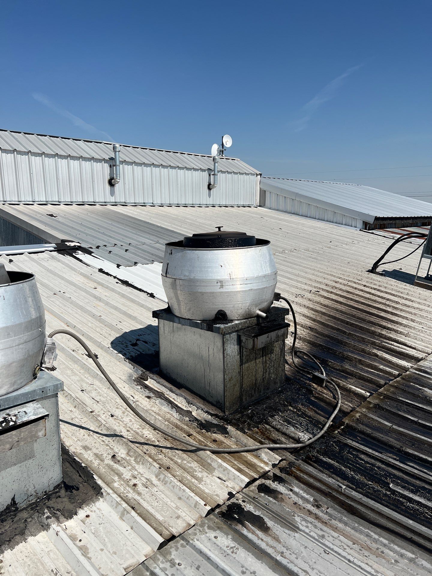 Commercial Roofing Repair using TRP #924 Eterna-Sil Premium Silicone Roof Coating by Harvey Roofing & Construction