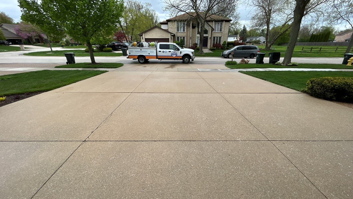 concrete patio and driveway cleaning by Northern Power Washing LLC.