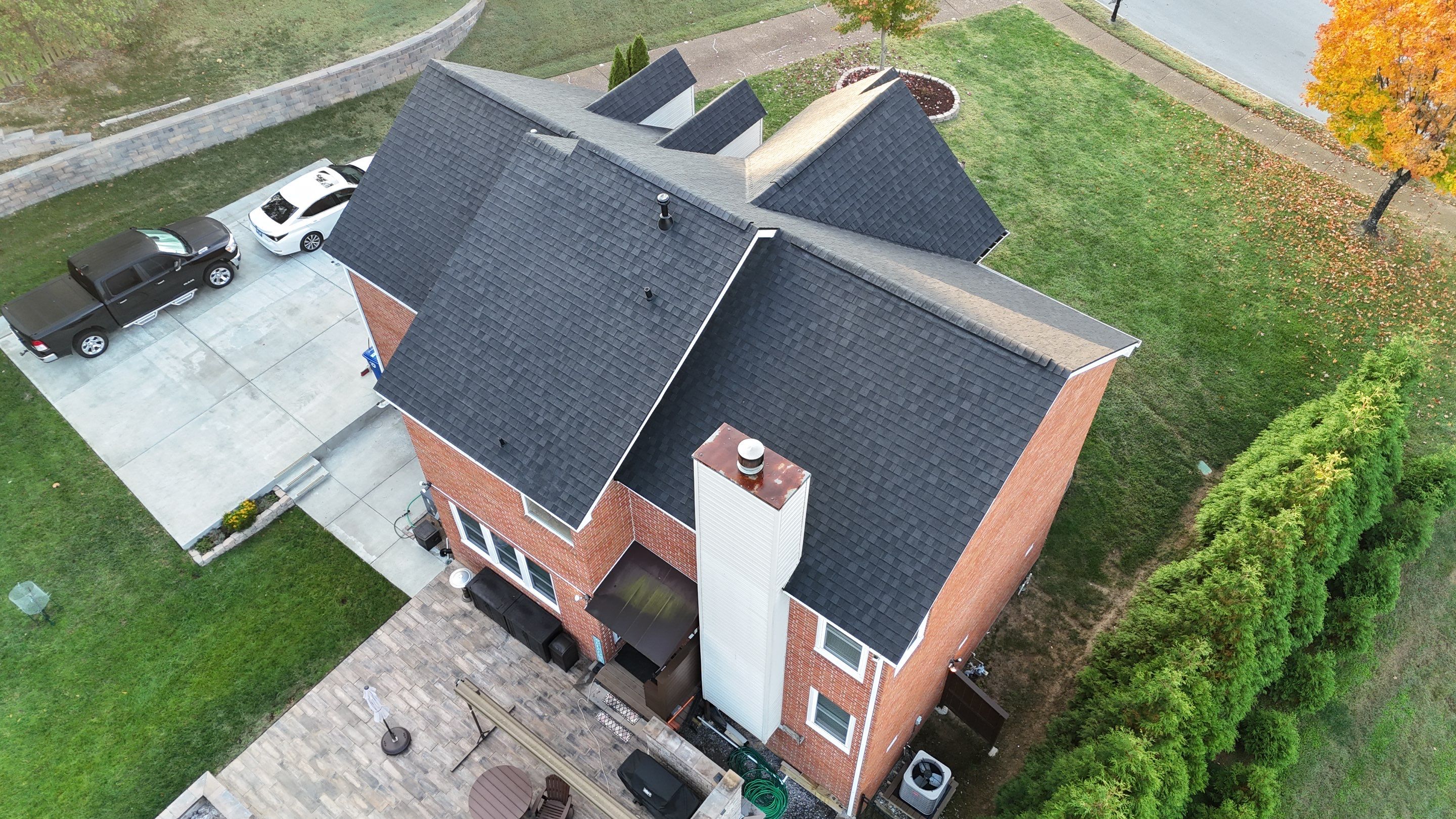 Charcoal Black Re-Roof & Gutters by Royal House LLC