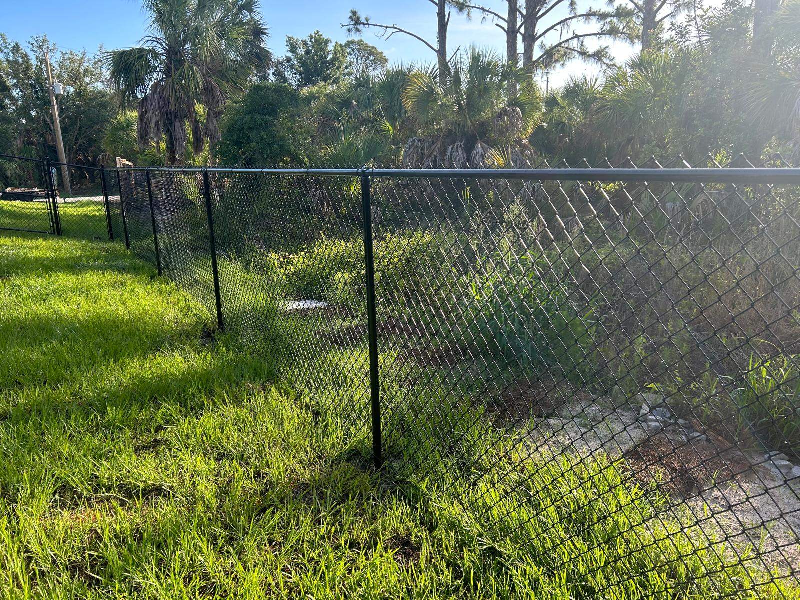 Residential Black Vinyl-Coated Chain Link Fence in Port Charlotte by True Fence LLC