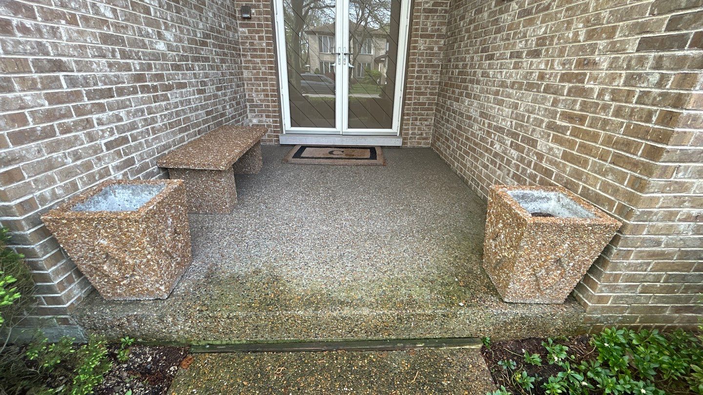 concrete patio and driveway cleaning by Northern Power Washing LLC.