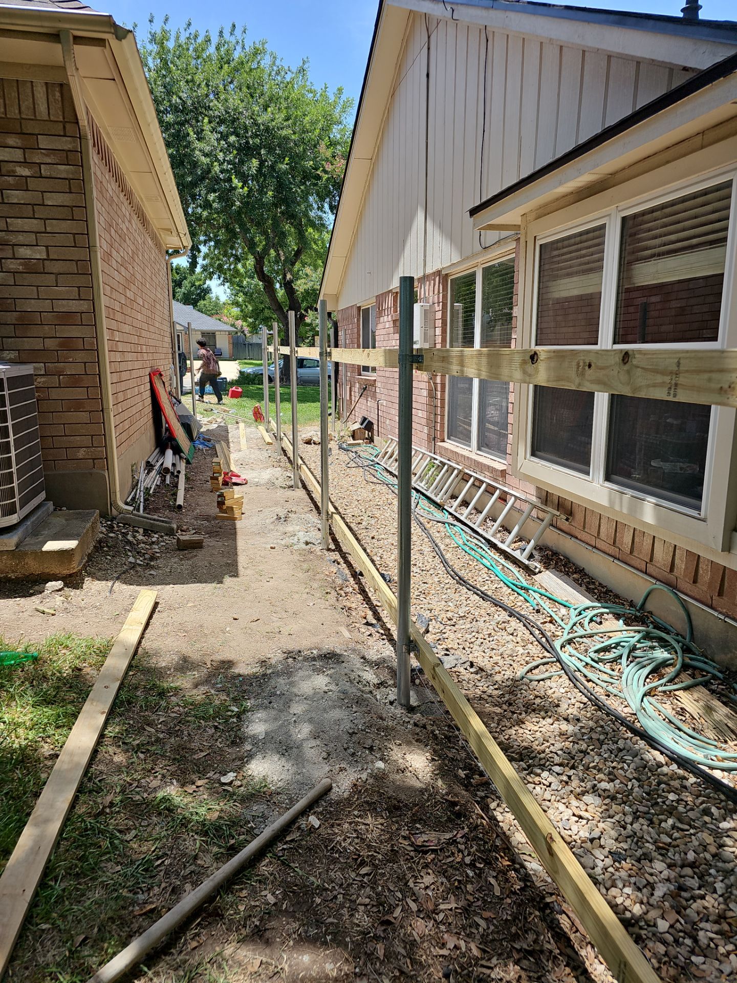 Fence Installation using Cedar Pickets by DeZign Roofing & Exteriors