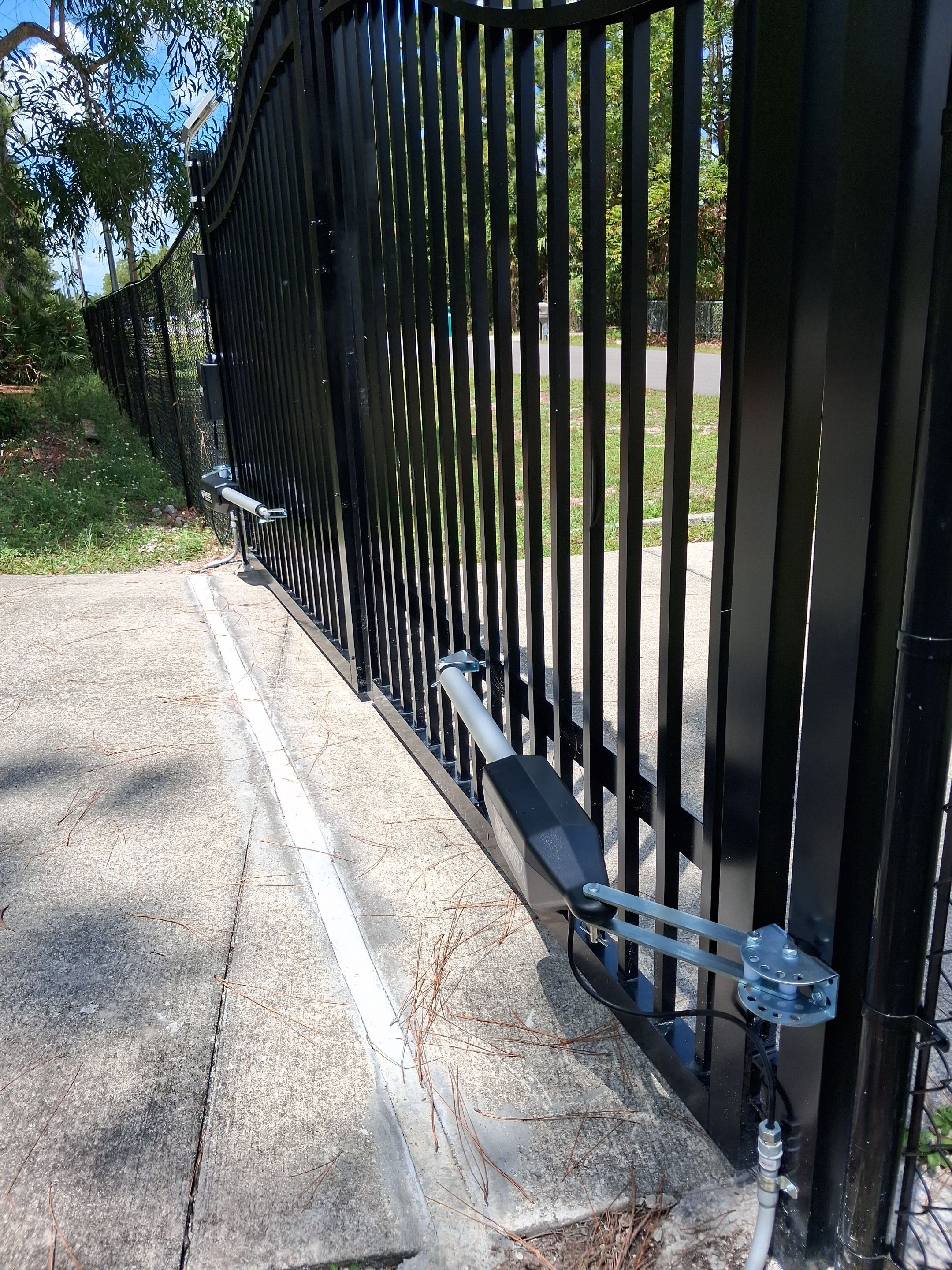 Automated Driveway Gate and Black Chain Link Fence Installation by True Fence LLC
