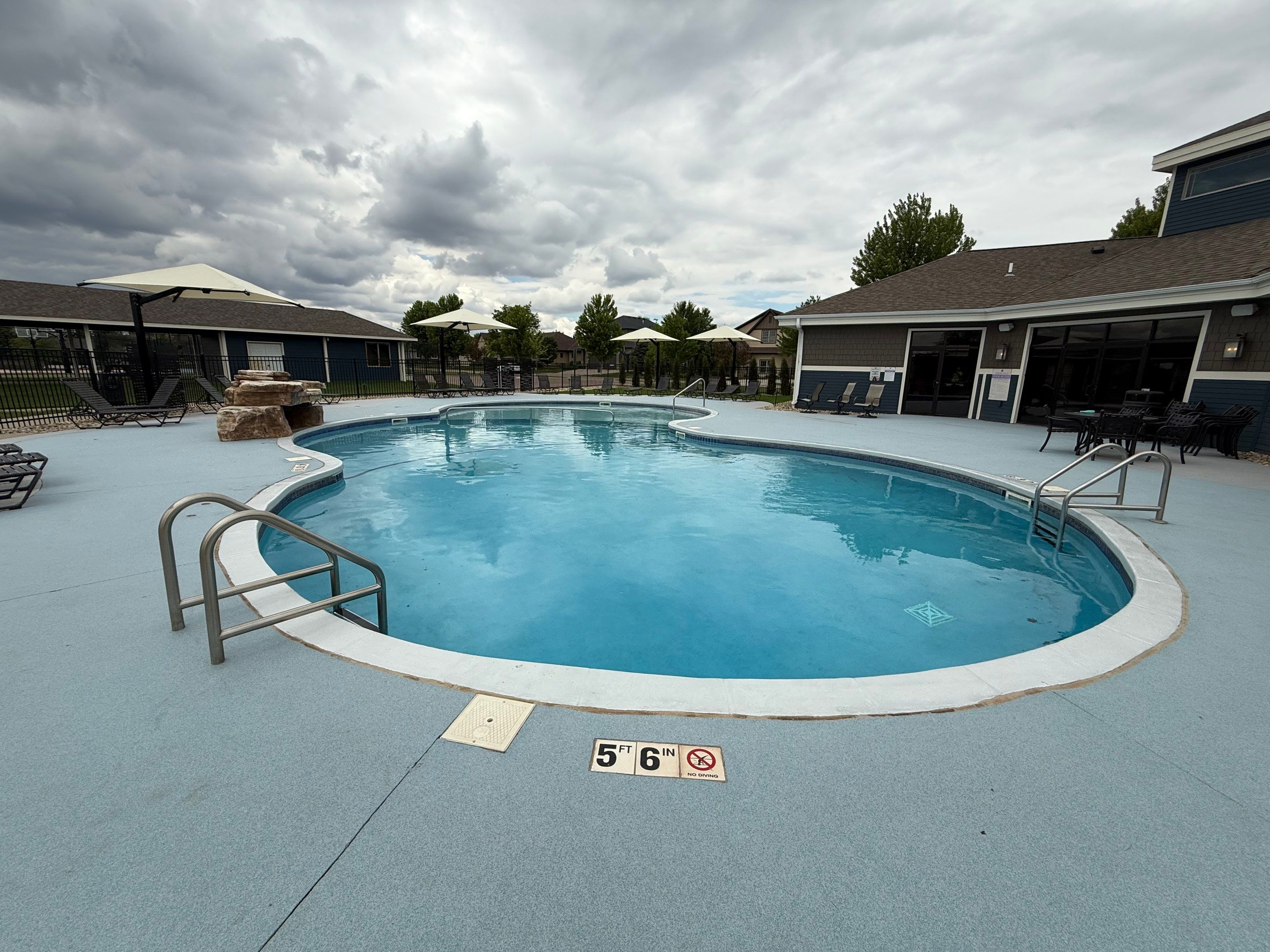 Arbors Edge Pool Deck Restoration and Textured Concrete Coating by Select Painting, Coatings & Garage Cabinets