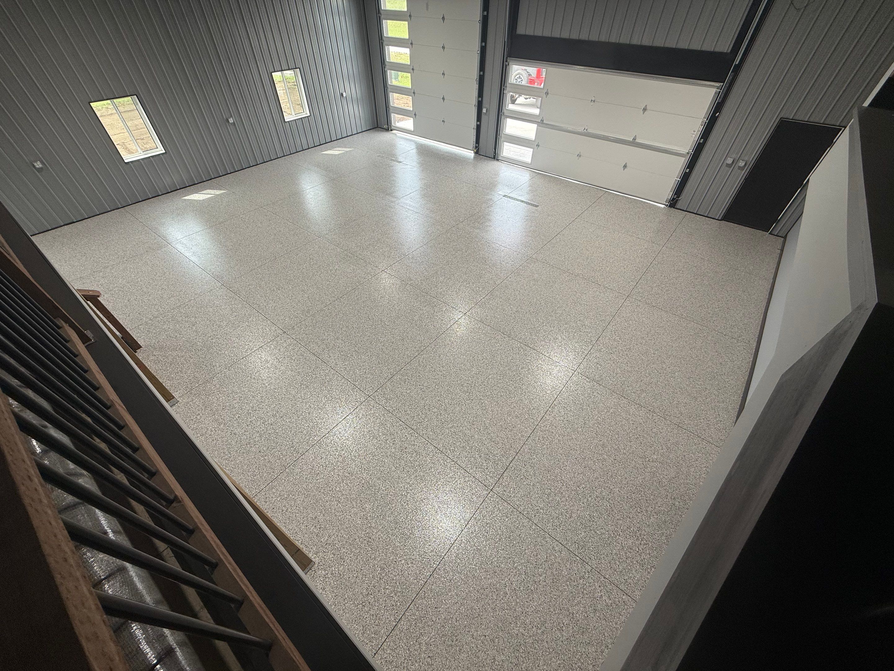 Polyaspartic Garage Floor Coating with Decorative Flake in Wentworth by Select Painting, Coatings & Garage Cabinets