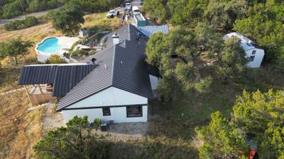 Residential Roofing Installation using Standing Seam Metal (Color, 500 Kynar Finish) in Matte Black