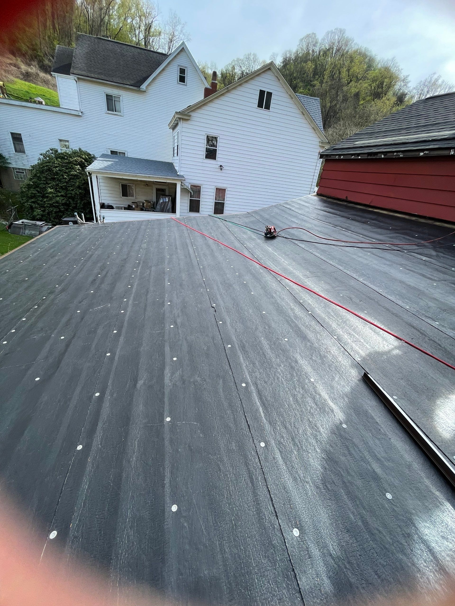 Roof sunspace deck  by Cousins Roofing Siding & Decks