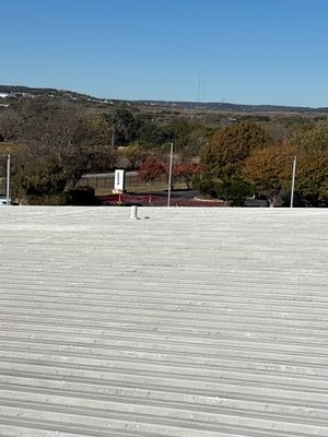 Clean, expansive view of a finished metal roof.