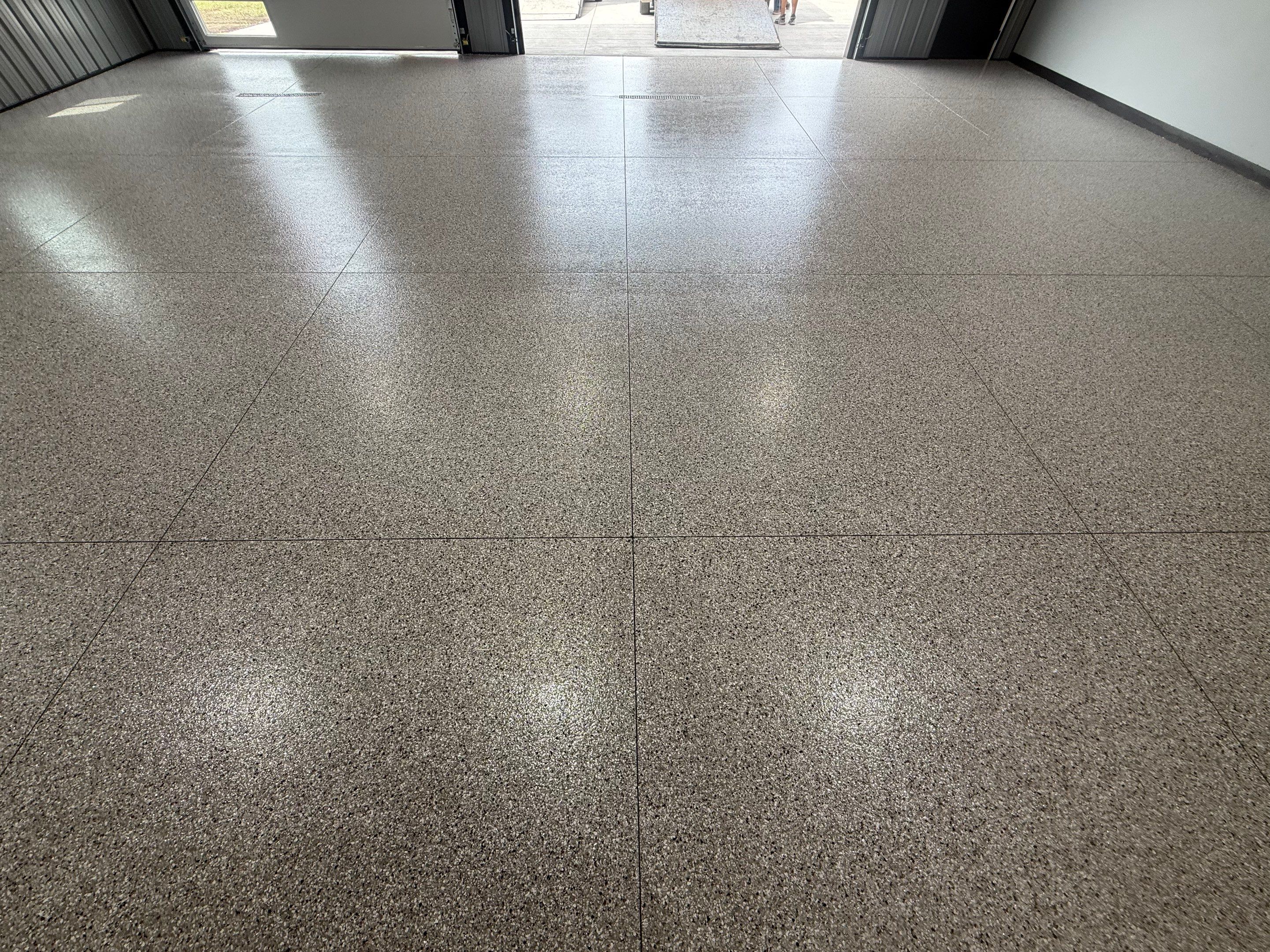 Polyaspartic Garage Floor Coating with Decorative Flake in Wentworth by Select Painting, Coatings & Garage Cabinets