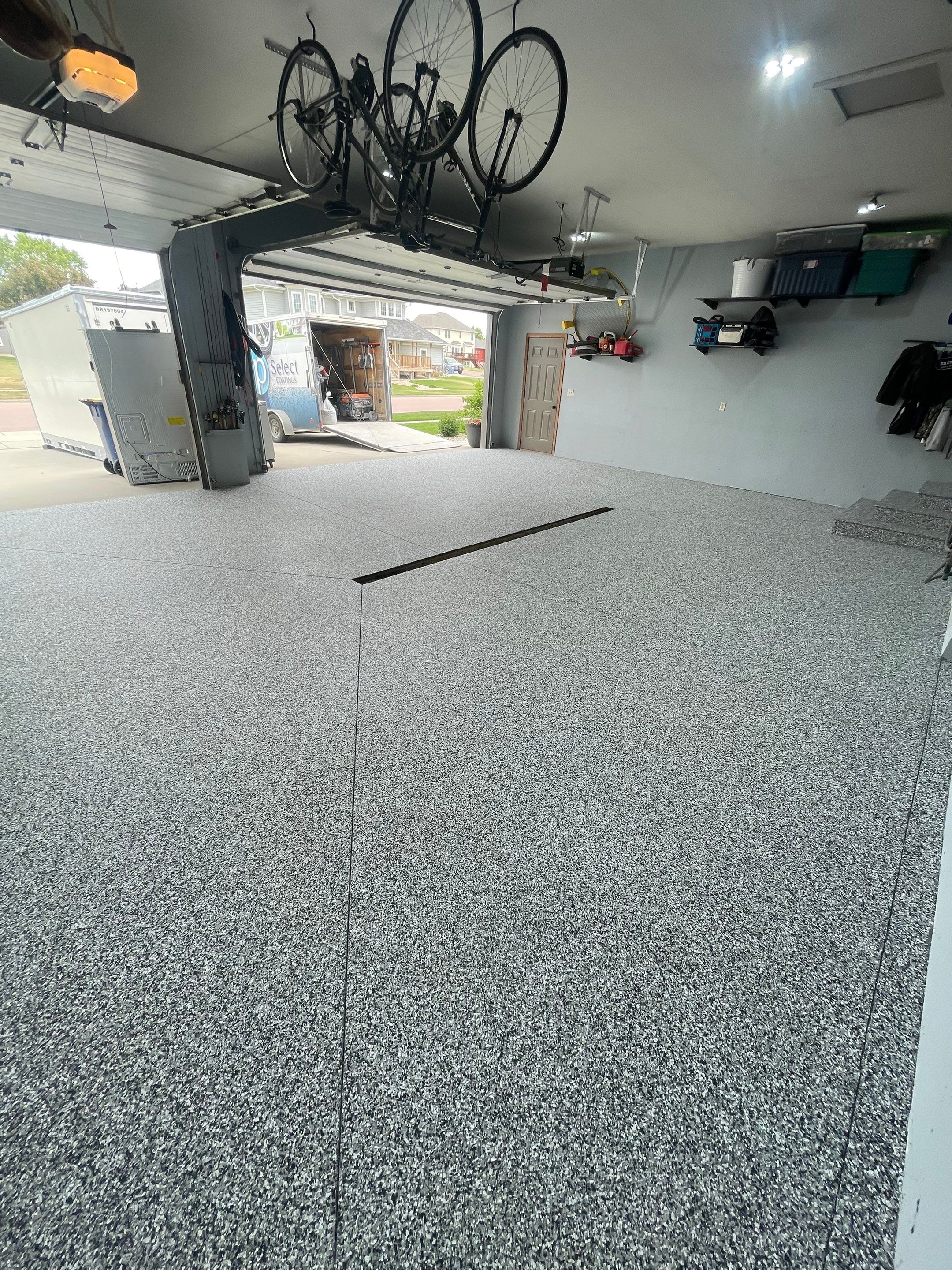 Full Garage Floor Epoxy Coating Installation in Dell Rapids by Select Painting, Coatings & Garage Cabinets