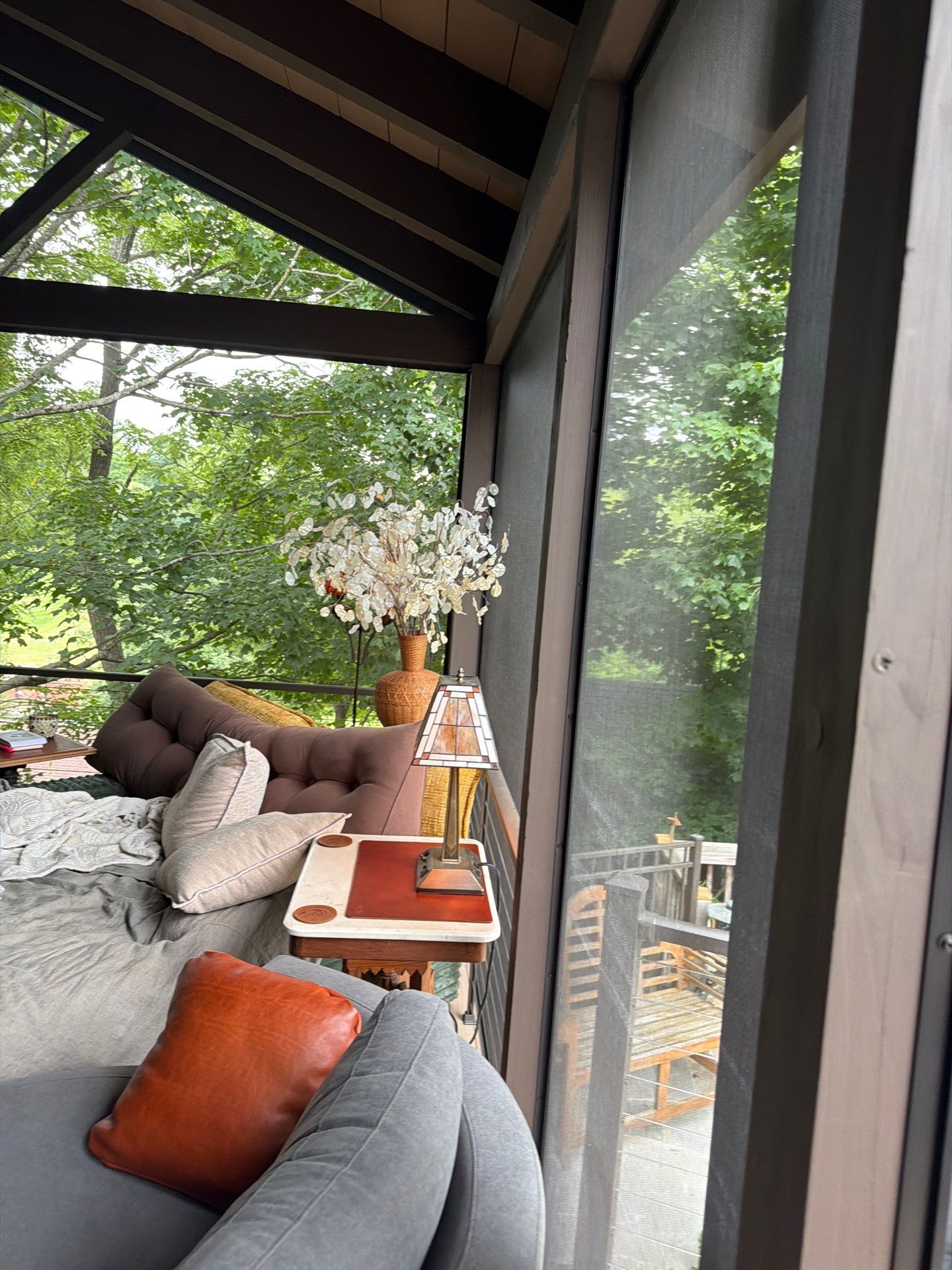 Custom Composite Deck with Stone Fireplace and Modern Cable Railing by Walnut Hollow Decks & Outdoor Living