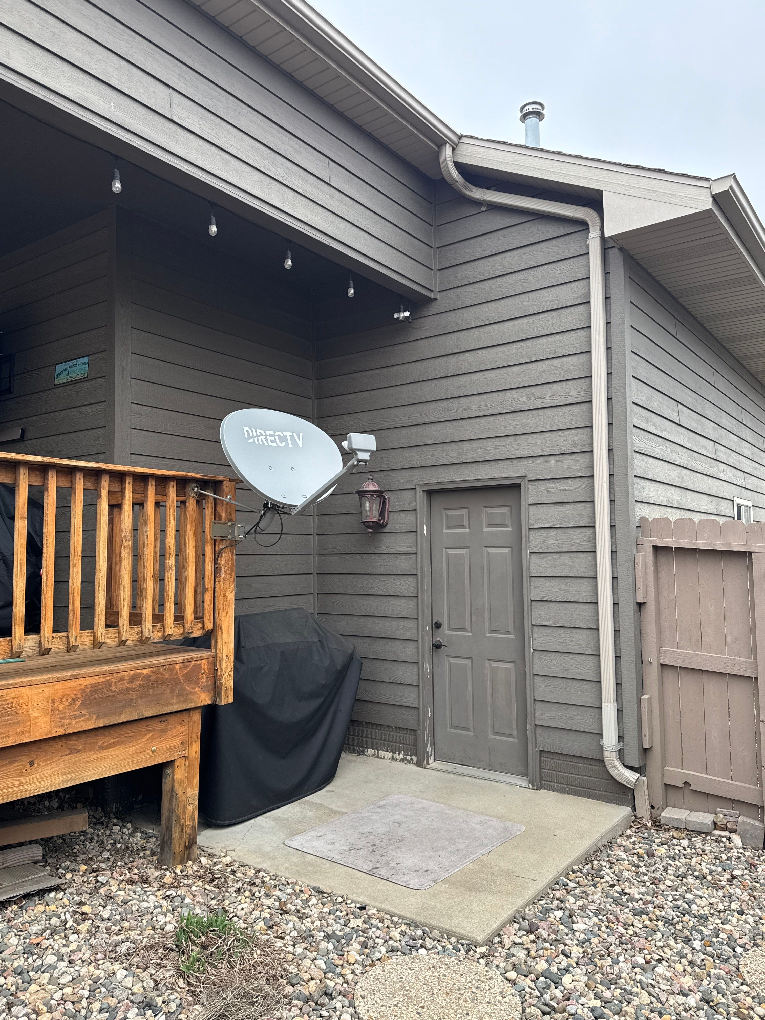Sioux Falls Residential Exterior Update and Flagstone Pool Deck by Select Painting, Coatings & Garage Cabinets