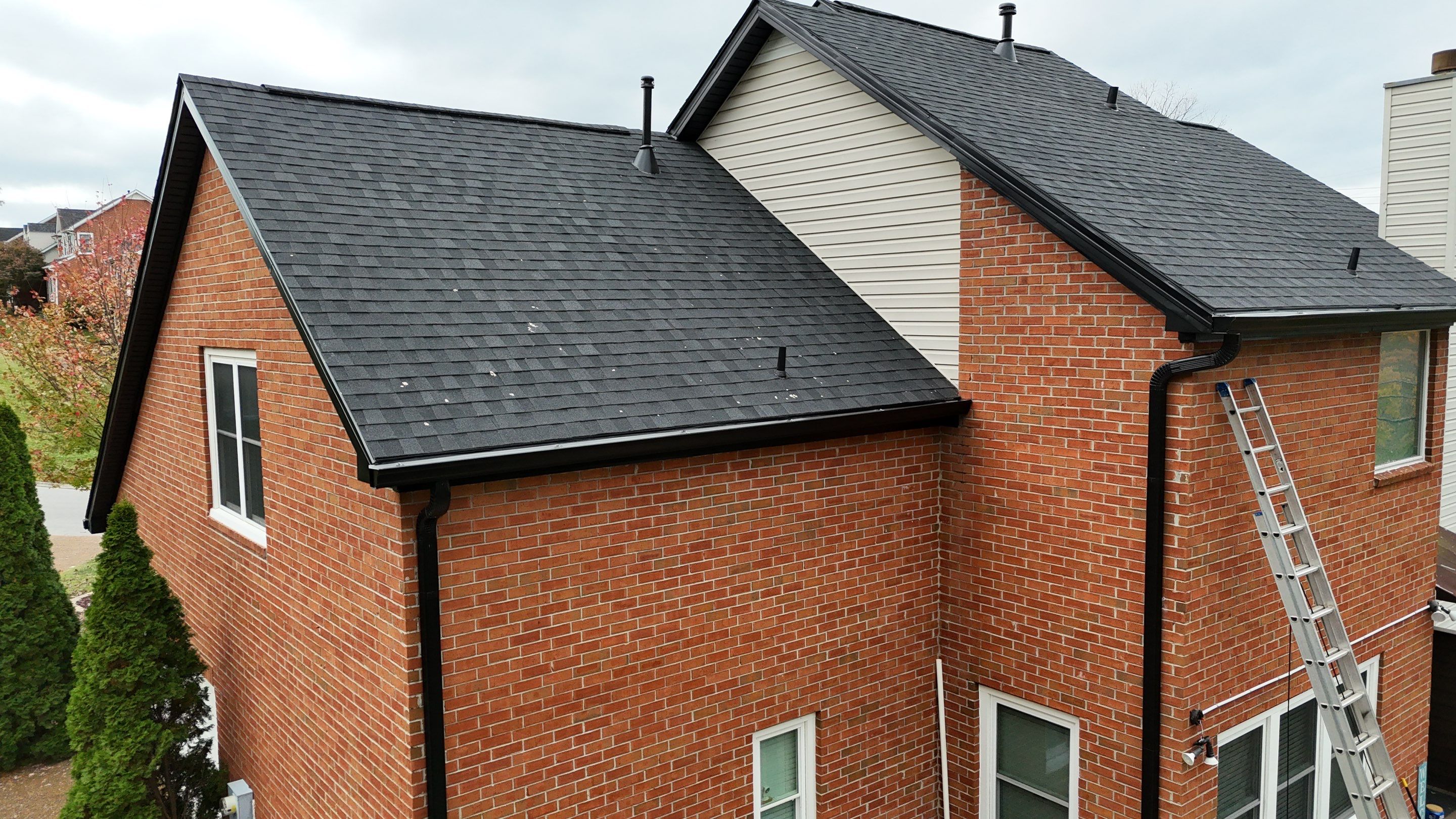 Charcoal Black Re-Roof & Gutters by Royal House LLC