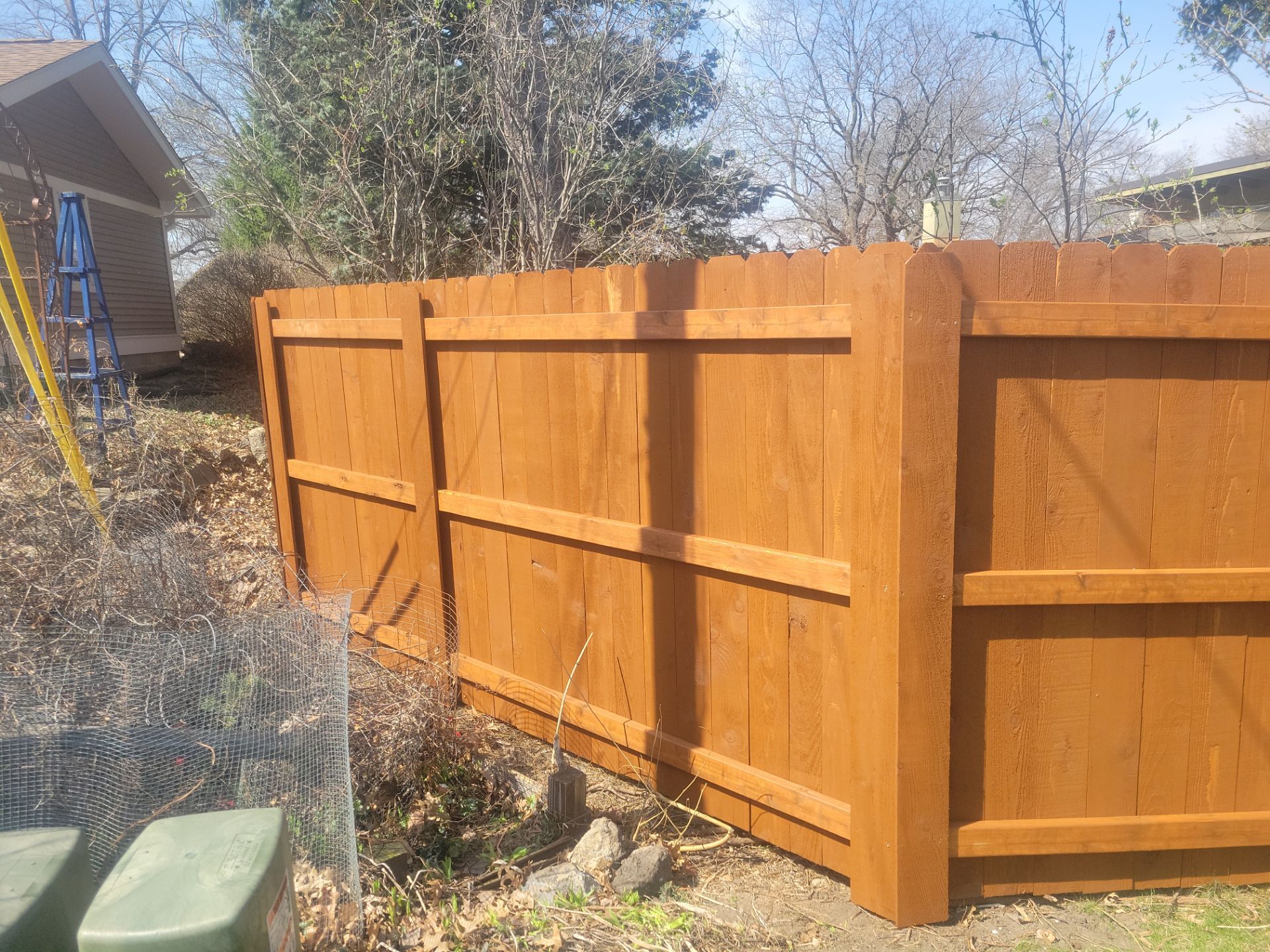 Stained Cedar Wood Privacy Fence Installation in Cedar Falls by Perfect Picket Fence and Stain