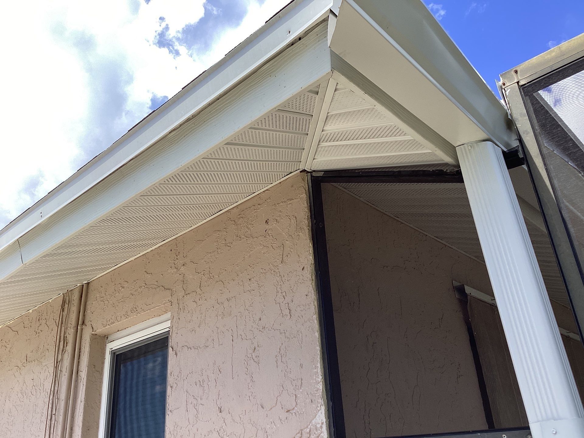 White Seamless Gutters and Splash Guards in Fort Myers FL by Gutter Professor by Gutter Professors
