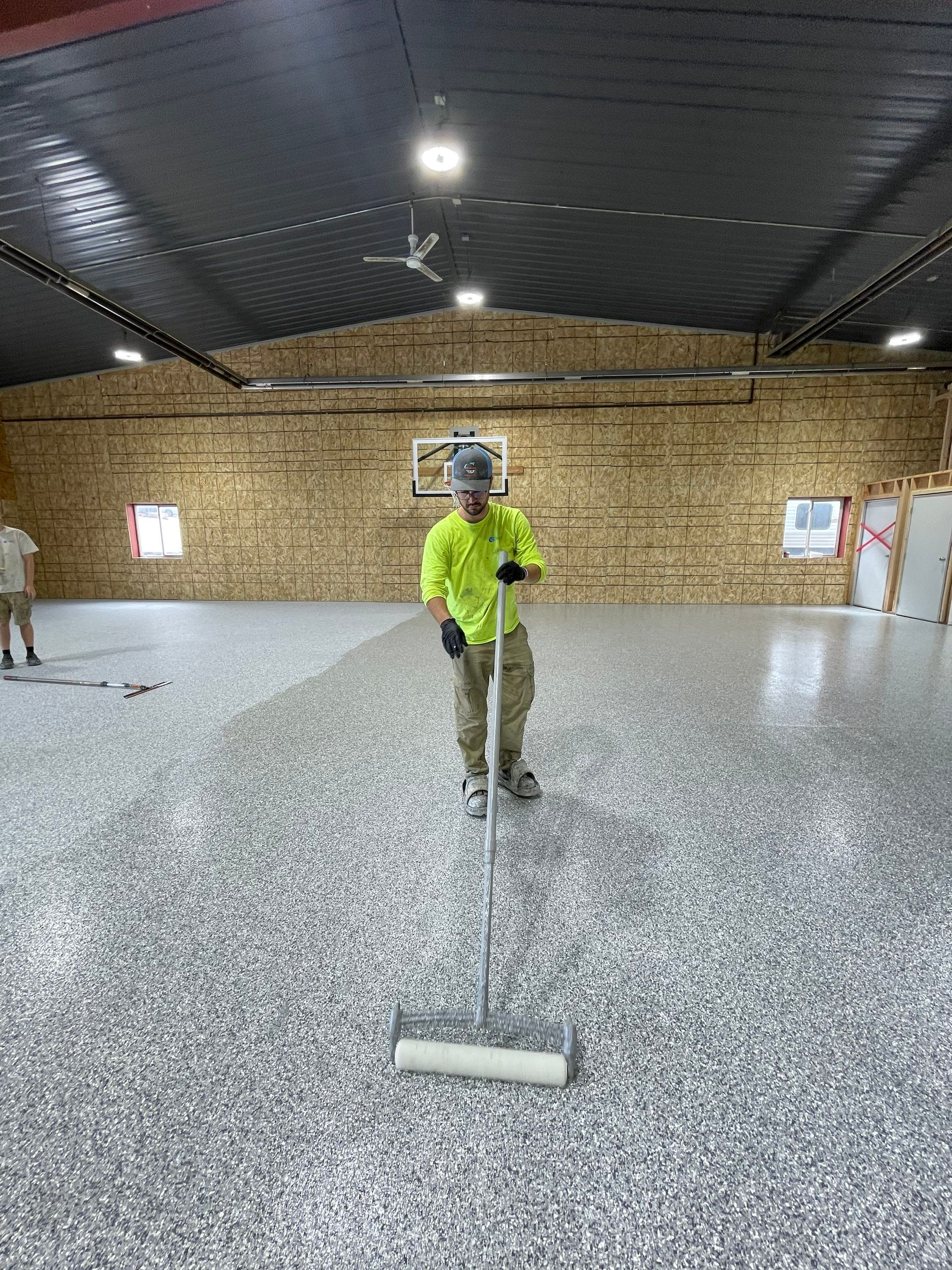 Custom Polyurea Shop Floor with Basketball Court Lines in Rock Valley by Select Painting, Coatings & Garage Cabinets