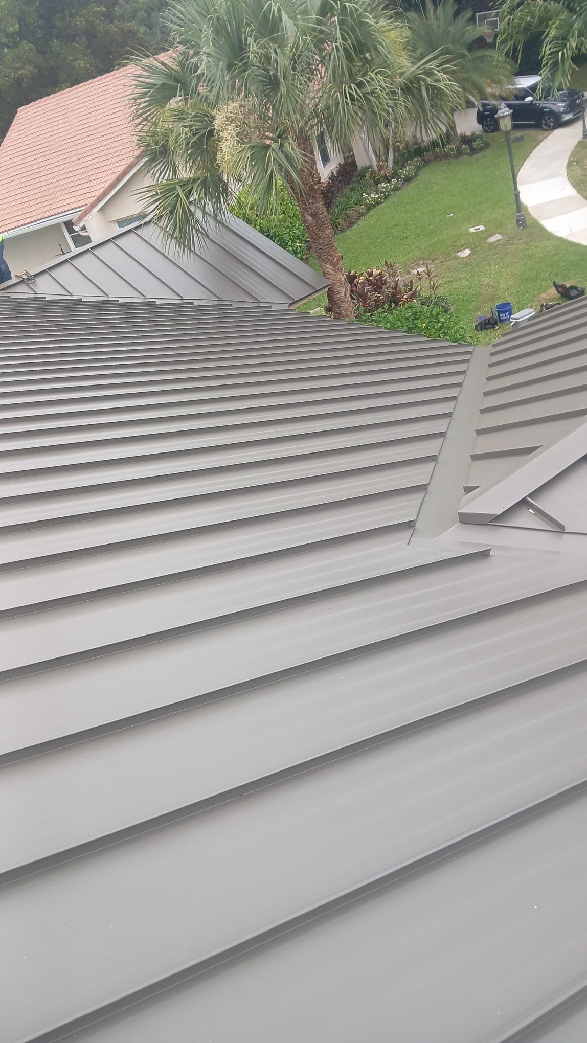 Residential Standing Seam Metal and Polyglass Flat Roof Replacement Boca Raton by AJF ROOFING INC