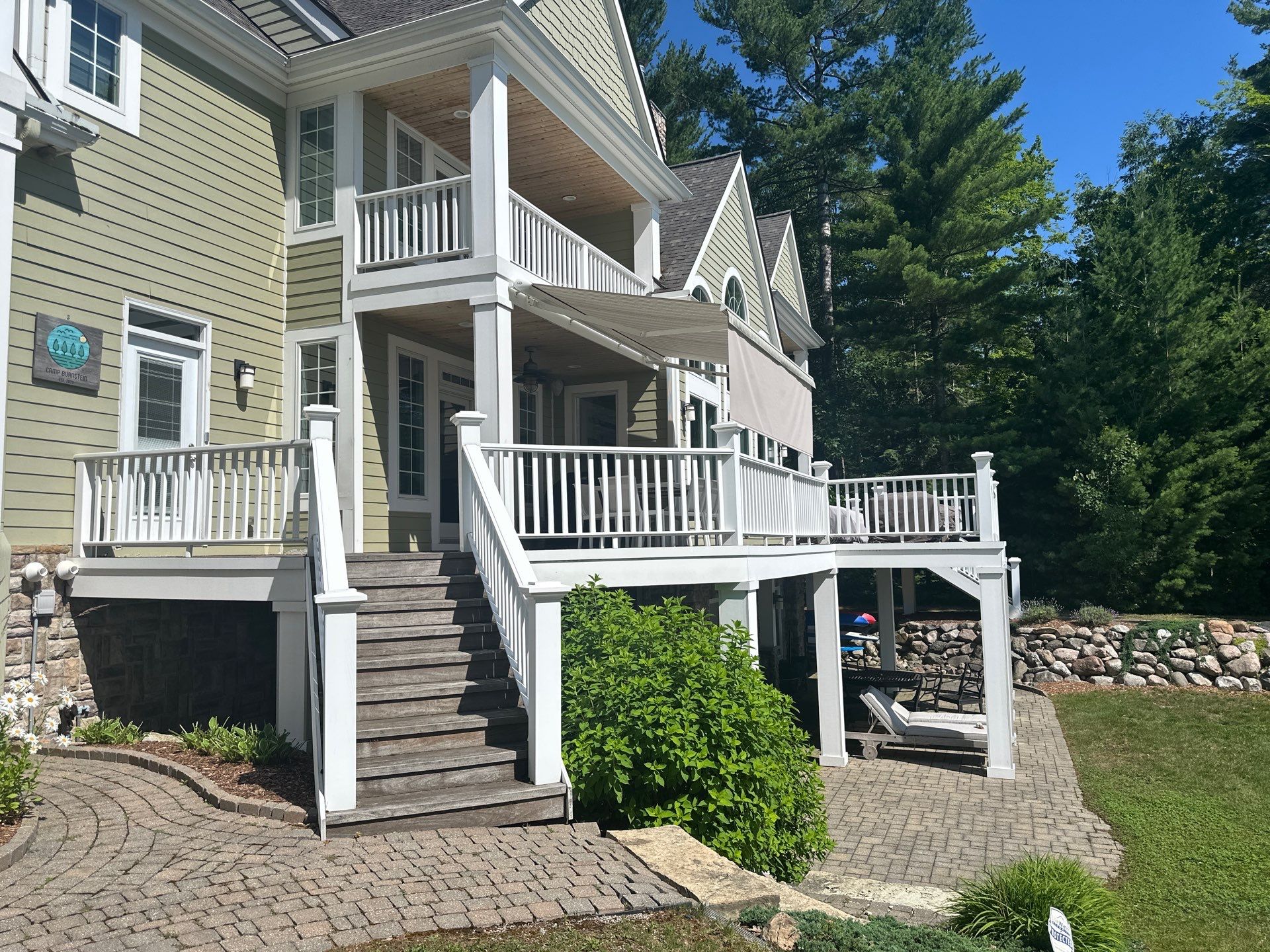 Sunesta Retractable Awning Installation for Lakeside Deck in Kewadin by Rainbow Seamless Systems