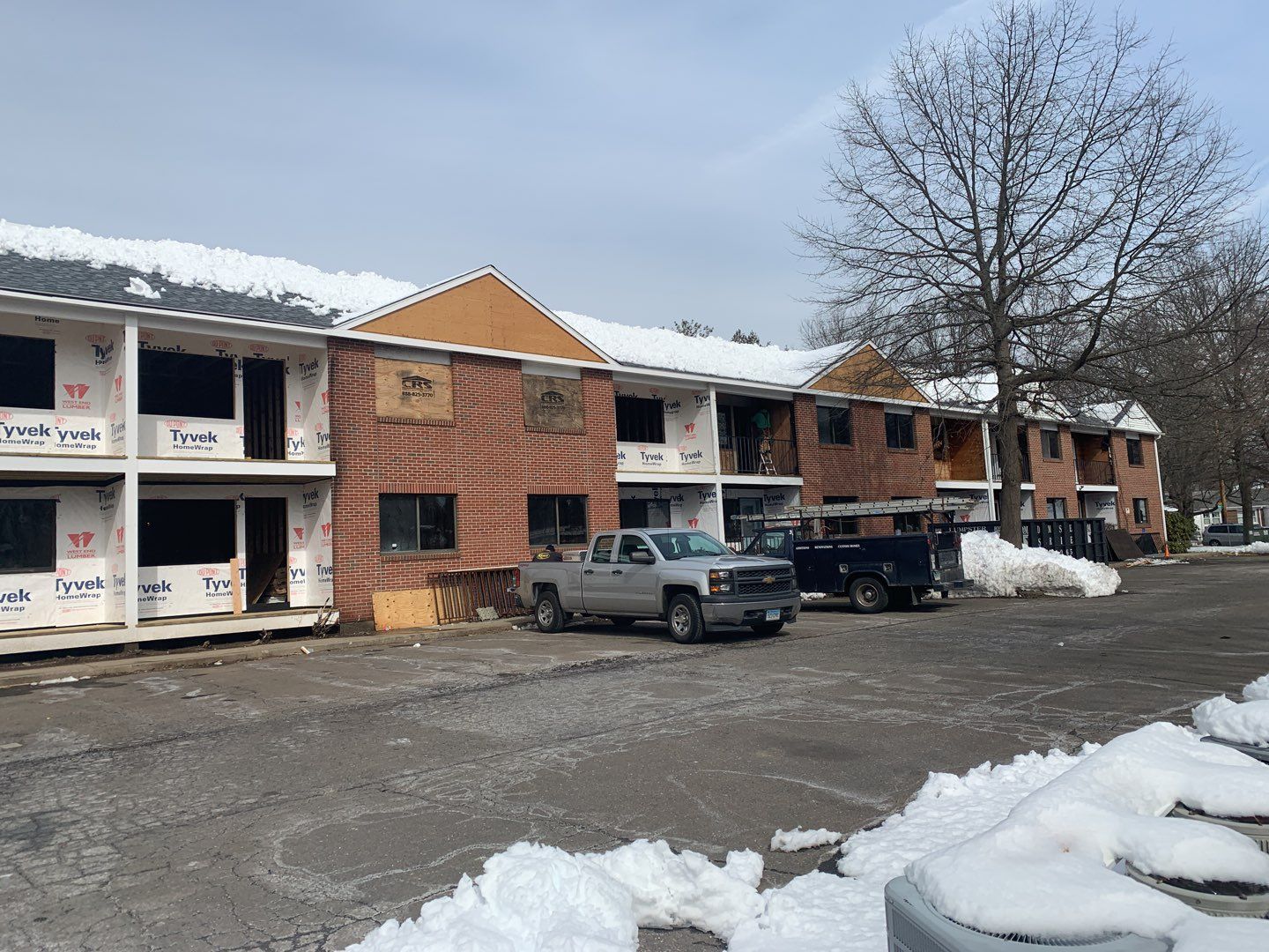Commercial Roofing Installation using EPDM with white gutters by A Plus Exterior
