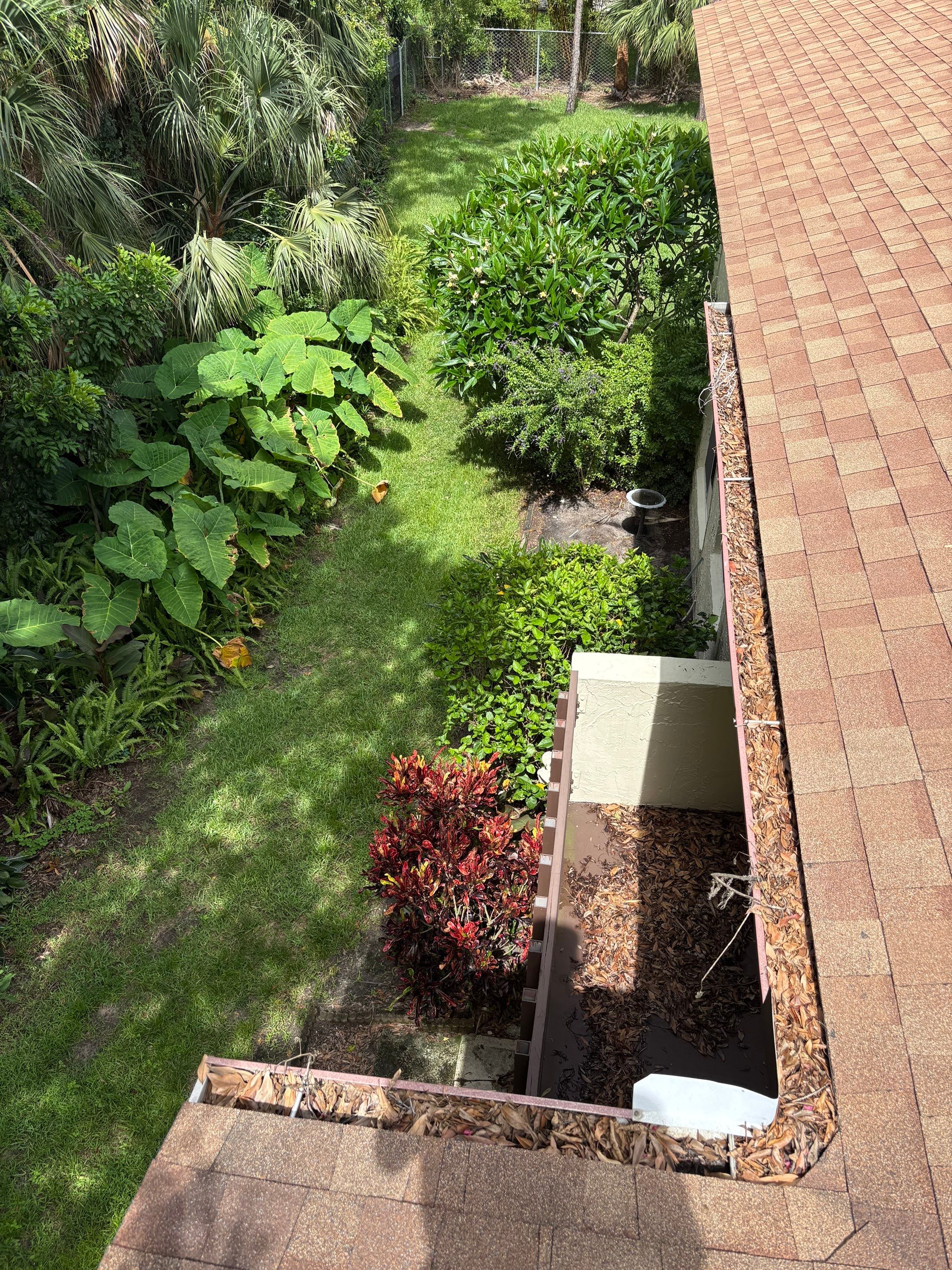 Commercial gutter cleaning Clearwater & Largo before photo with filled gutters