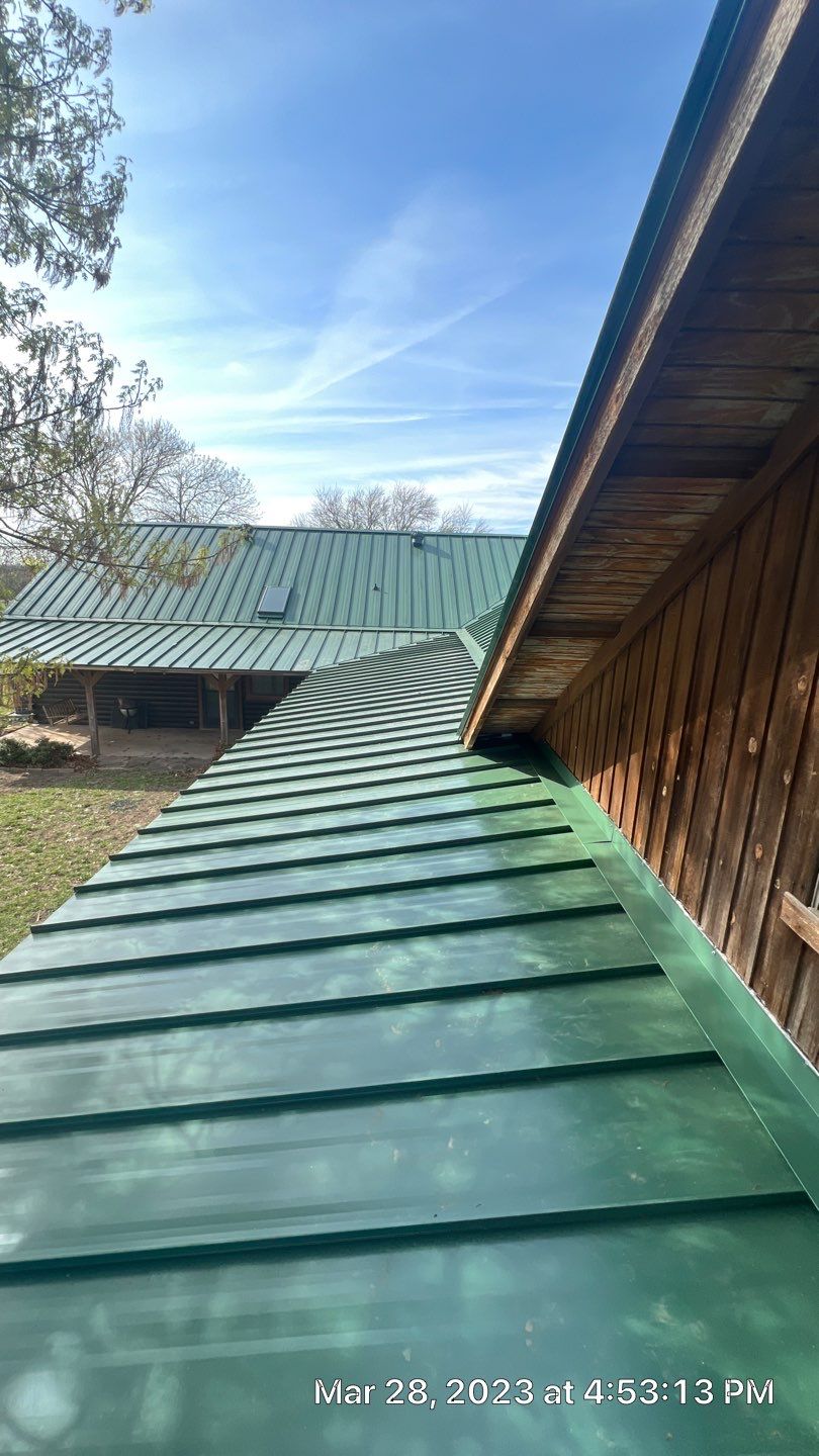 Shingle to Standing Seam Metal Roof by Springtree Restoration 