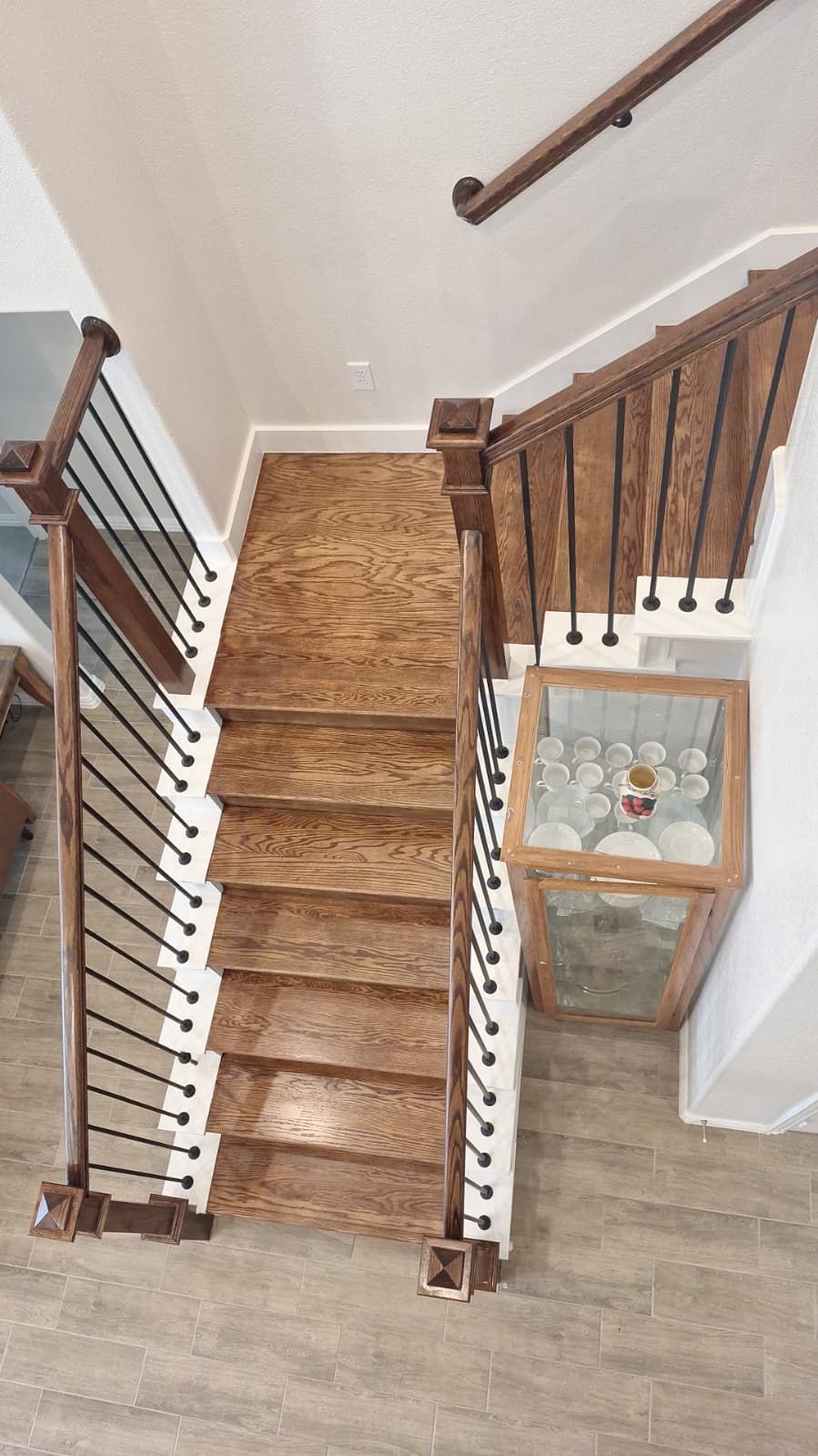 Carpet replacement with Tile and Red Oak Stairs by EL-GC LLC 
