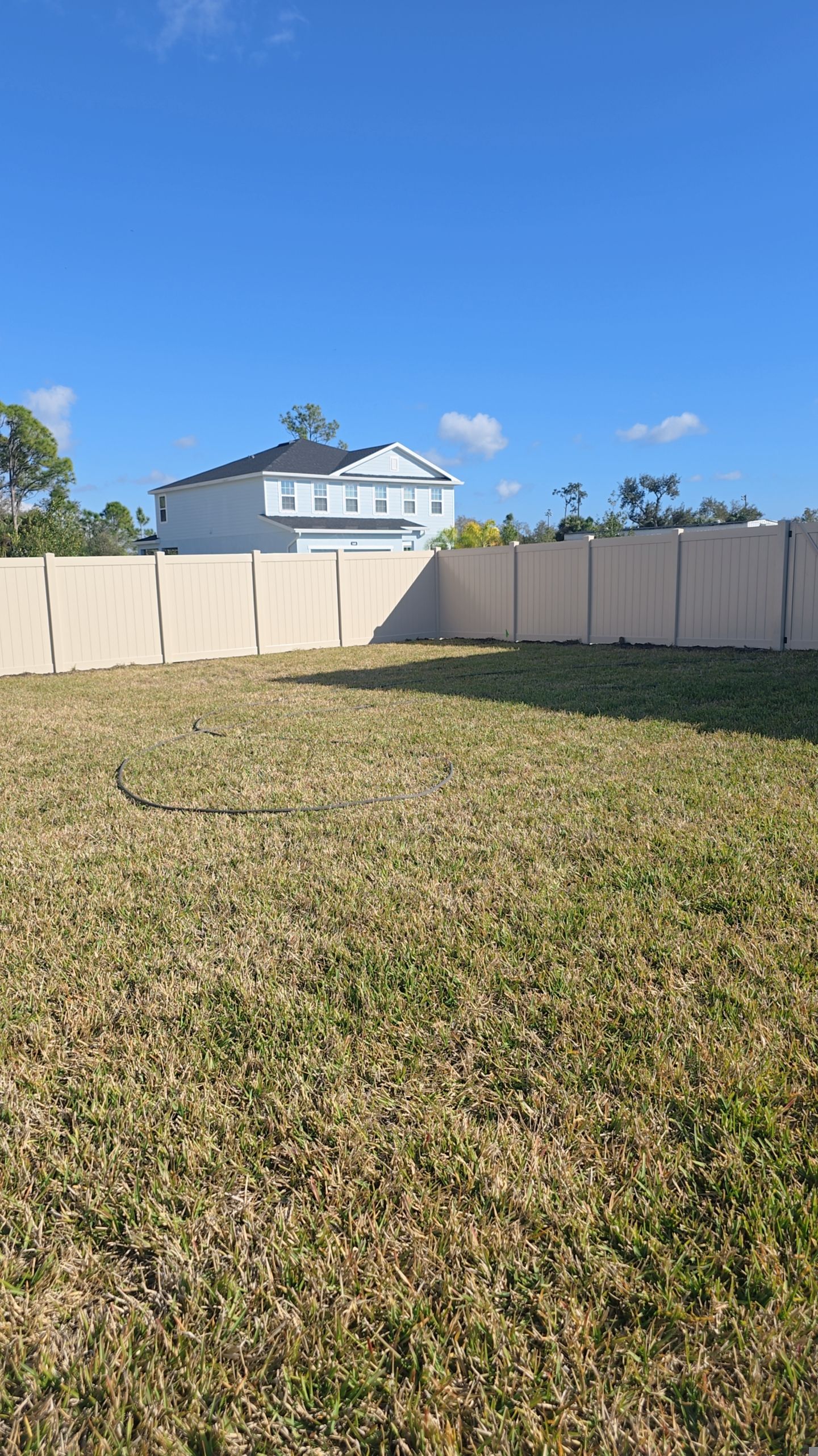 Tan Vinyl Fence in West Port by True Fence LLC